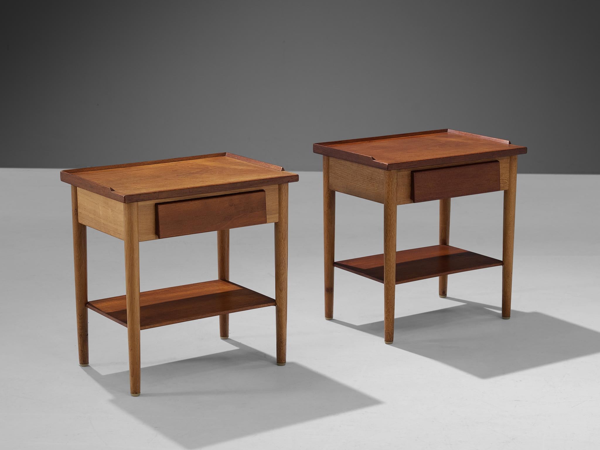 Nightstands, teak, oak, Denmark, 1960s.

The design of this pair of nightstands shows a strong and solid construction executed in teak and oak. This is realized by the sharp and clear lines which are visible at the edges of the top and at the