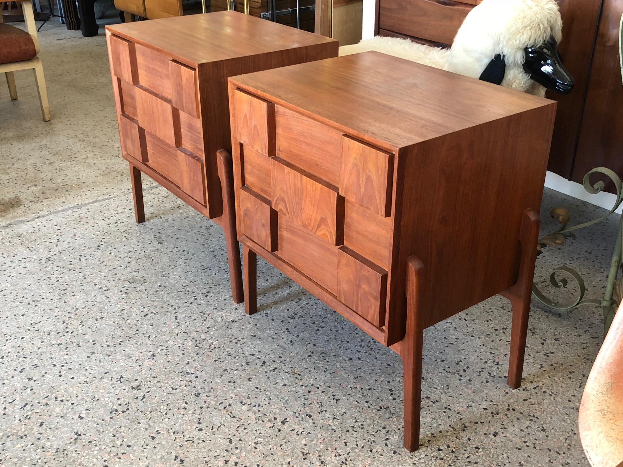 A pair of interesting, vintage Danish nightstands. Drop fronts with slide out drawers, checkerboard design, finished backs, sculptural flared legs.
