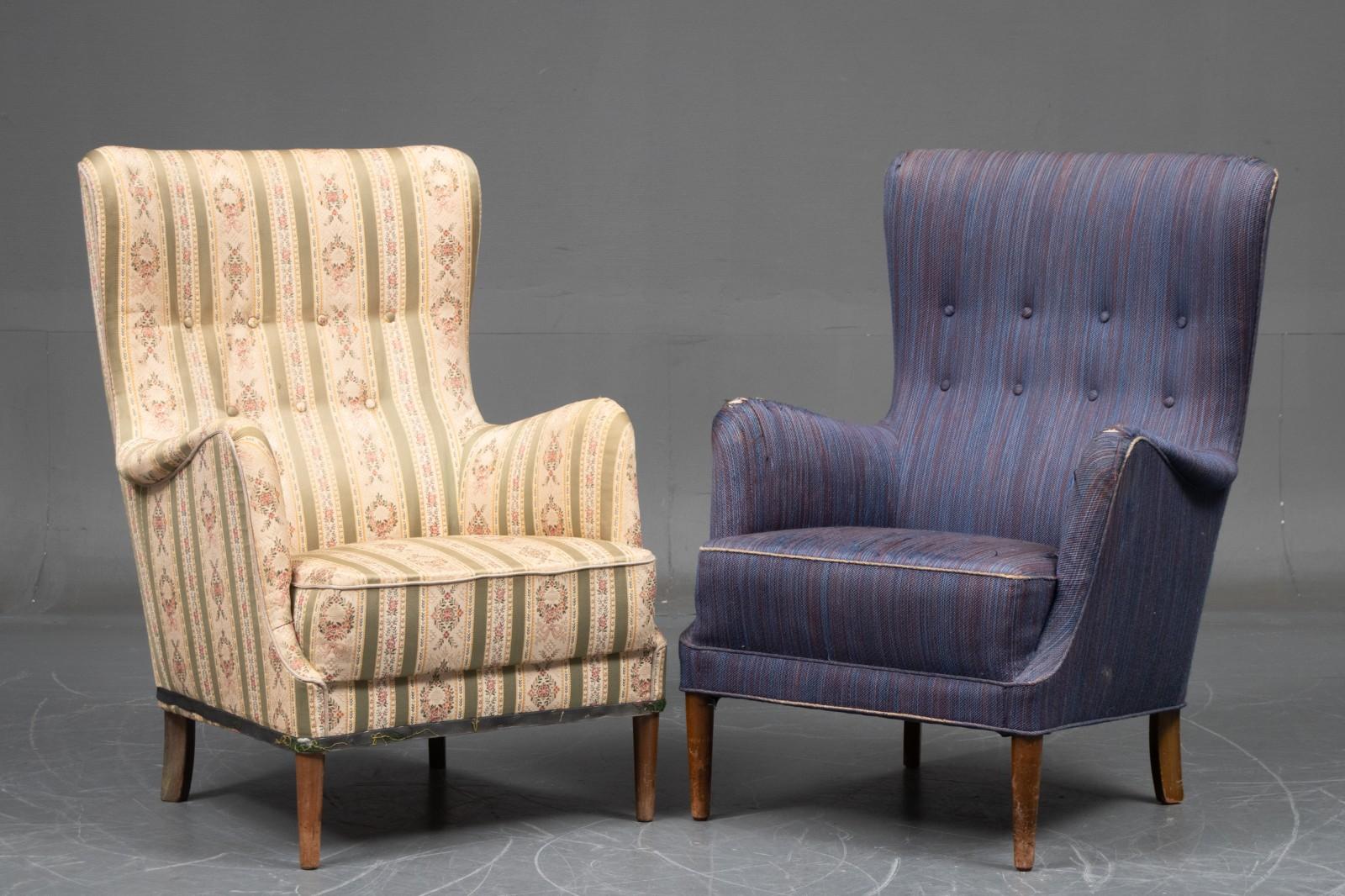 Elegant pair of 1950s lounge chairs attributed to Peter Hvidt and Orla Molgaard made in Denmark between 1940-1950 and most likely manufactured by Fritz Hansen. The chairs exhibit the rolled armrest detail and tapered front legs often preferred by