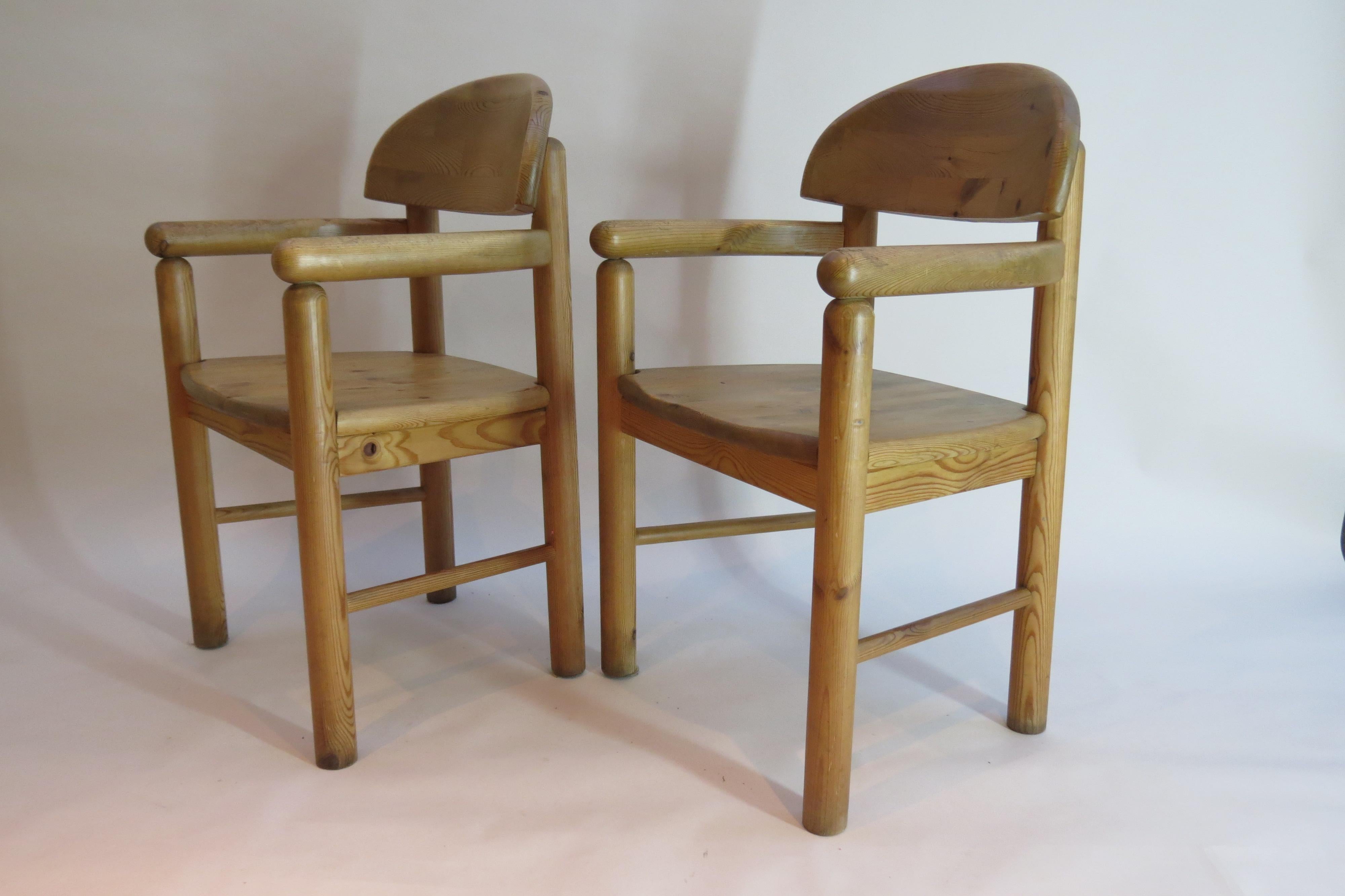Pair of Carver dining chairs made from solid pine, designed by Rainer Daumiller, and manufactured by Hirtshals Sawmill in Denmark, circa 1970s.

Very well made solid carver chairs in good over all condition, some signs of wear to arms as shown in
