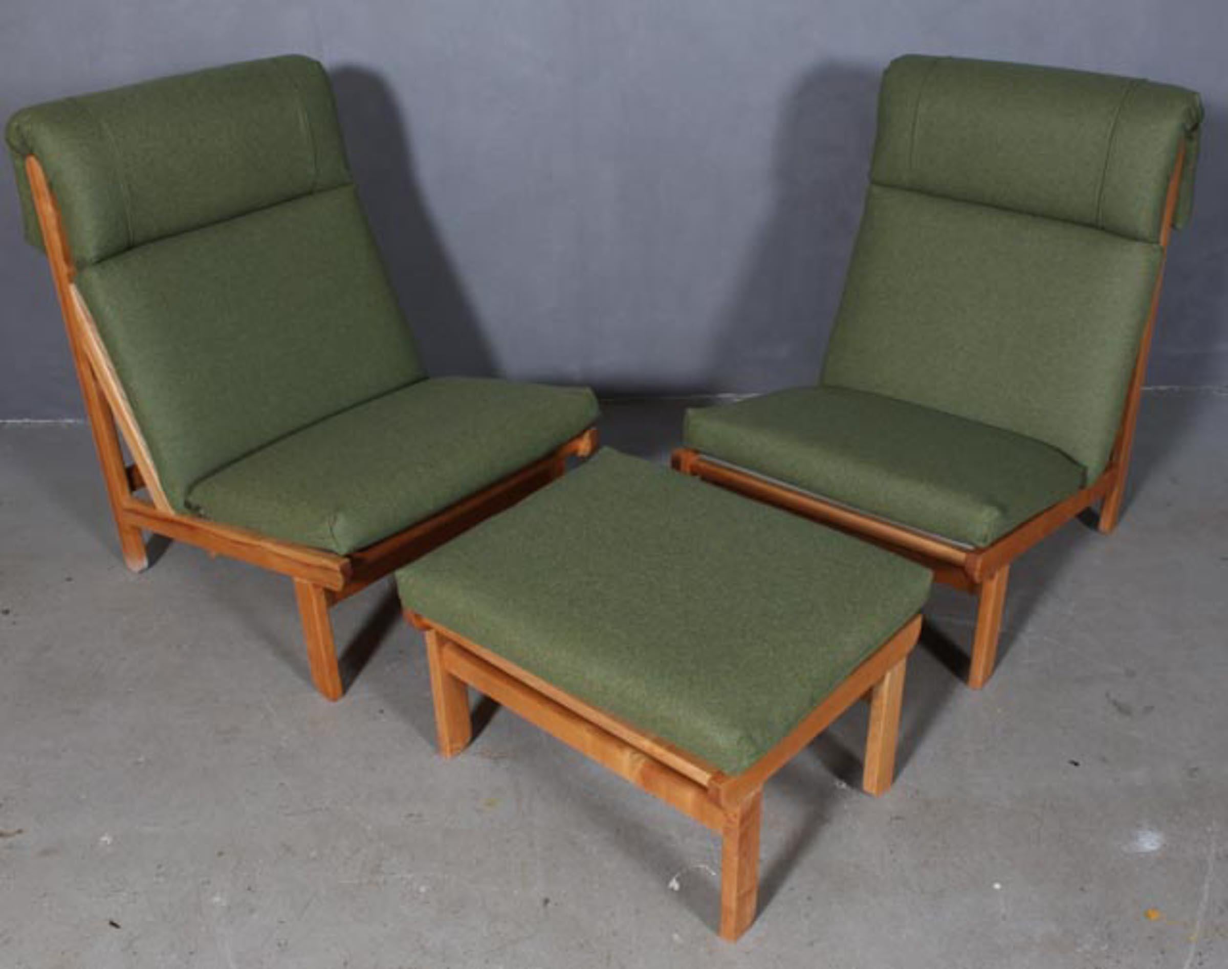Rare and very sought after pair of easy lounge chair designed by Bernt Petersen for Schiang Furniture of Denmark in 1966. Pine frames with loose cushions in seat and back upholstered with wool. The chairs are very comfortable with a low sloping