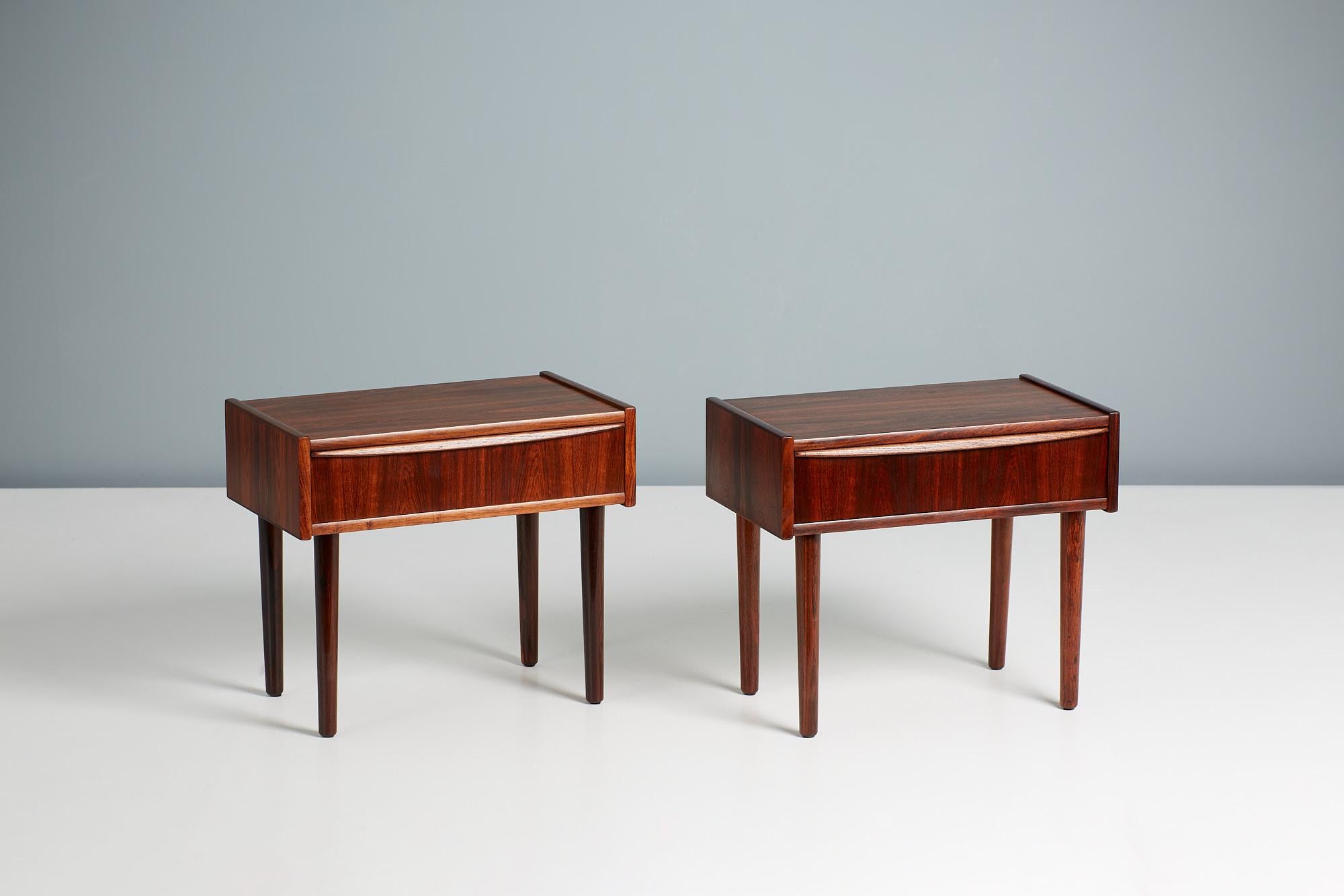 Pair of Danish cabinetmaker bedside nightstands produced circa 1960. Made from solid and veneered rosewood with a single drawer per nightstand.
