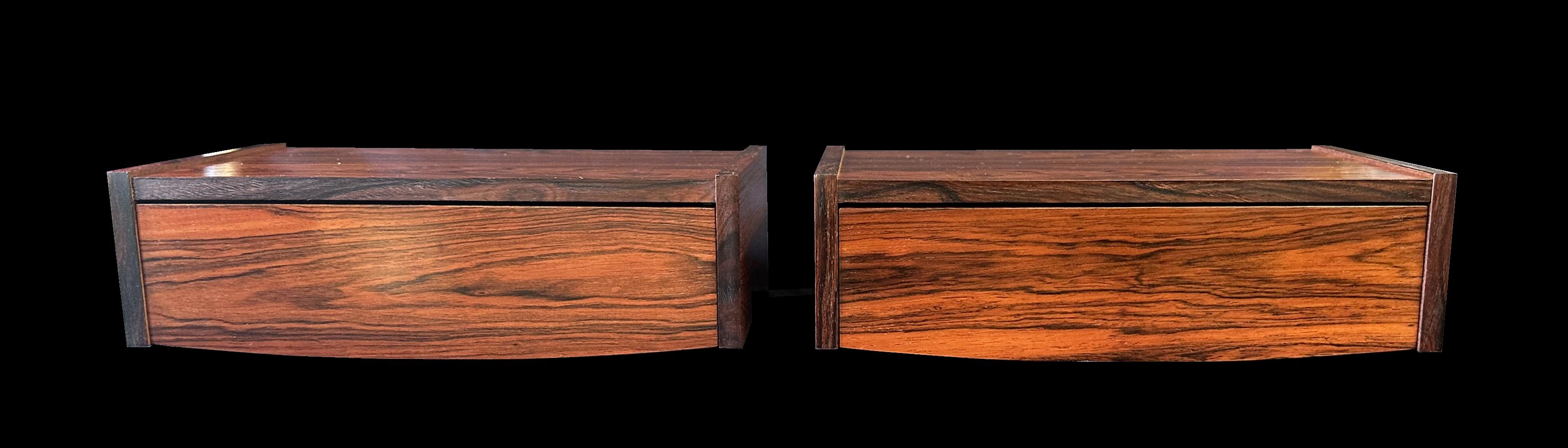These are very nice Santos Rosewood (machaerium Scleroxylon) single drawer bedsides. They are mounted on the wall simply with two screws through the backboard and then replacing the drawer for invisible fixing.
Condition is excellent on both, and