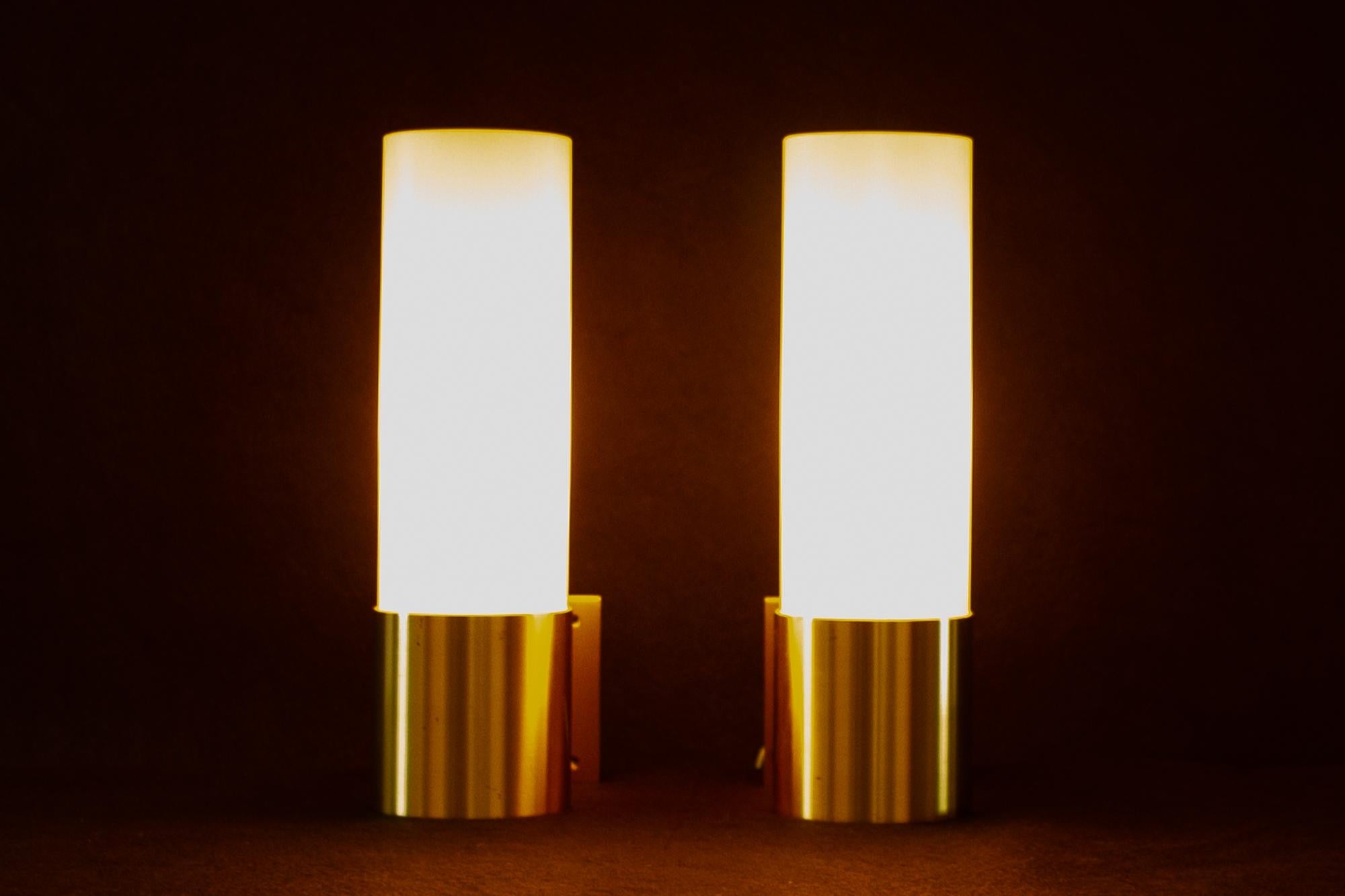 Pair of Danish sconces by Fog & Mørup, 1960s.
Set of two matching wall light in brass with hand blown opal glass shades designed by Professor Jørgen Bo and made by Danish lighting manufacturer Fog og Mørup in the 1960s. E27 socket. Shade has a