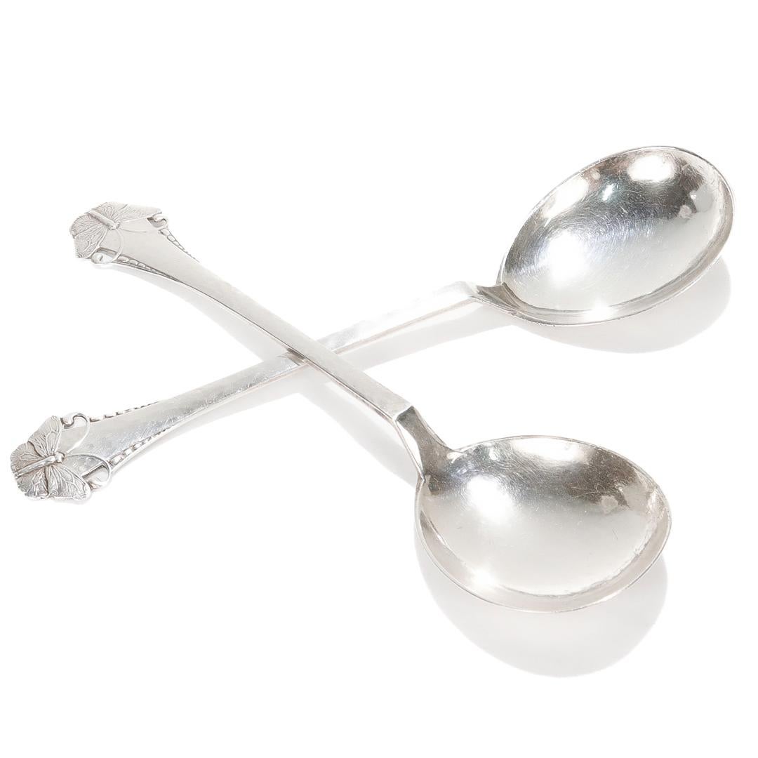 A fine pair of 2 Danish silver teaspoons.

In the Butterfly or Sommerflugl pattern.

By Frigast.

With Danish assay marks for 1919 and a minimum silver fineness of 826/1000. Marked for the assay master Christian F. Heise. 

Each bearing a stylized