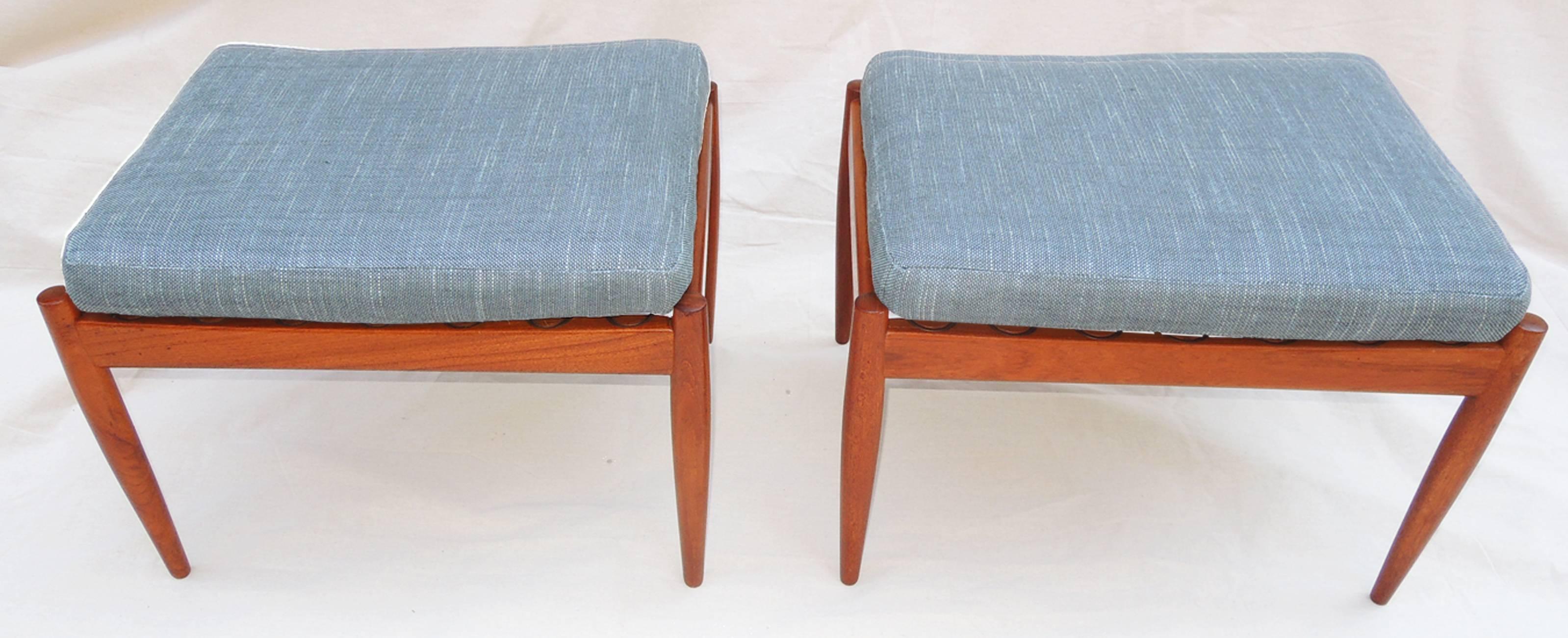 Simple and elegant pair of teak footstools by Kai Kristiansen for Magnus Olesen Durup in 1950s. Light, easy to move and covered in period-style textured fabric by Mokum. Original labels intact.