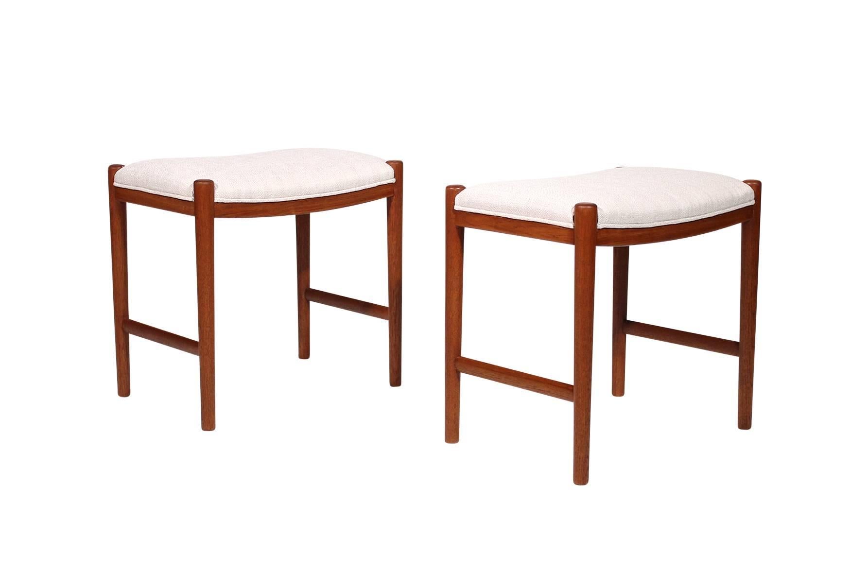 Pair of teak Danish stools in the manner of Hans Wegner's designs.