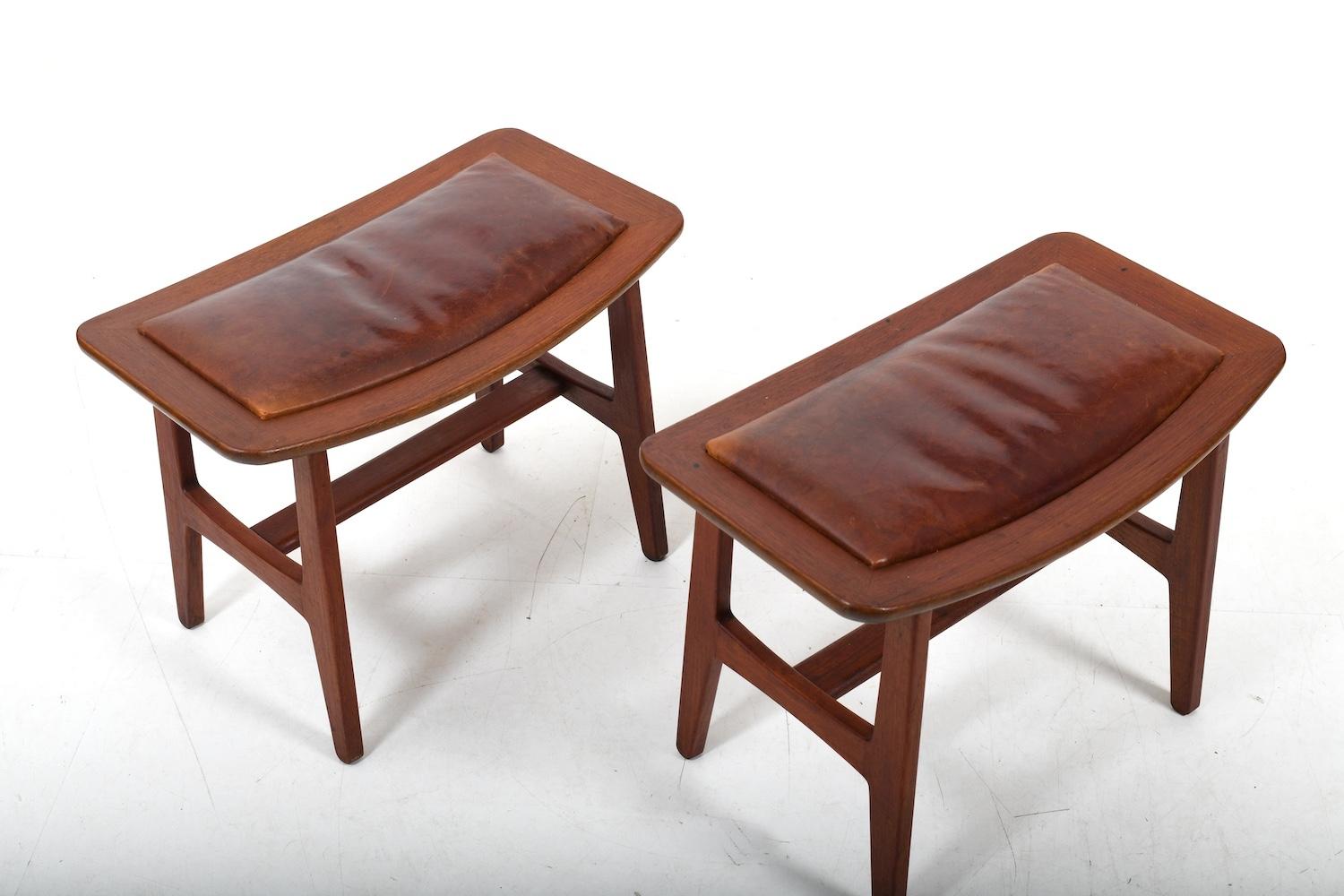 Pair of danish stools, ade in solid teak and original patinated brown leather. Denmark 1960s. In original condition. Can use also as ottoman. Very good quality.Price p. set.