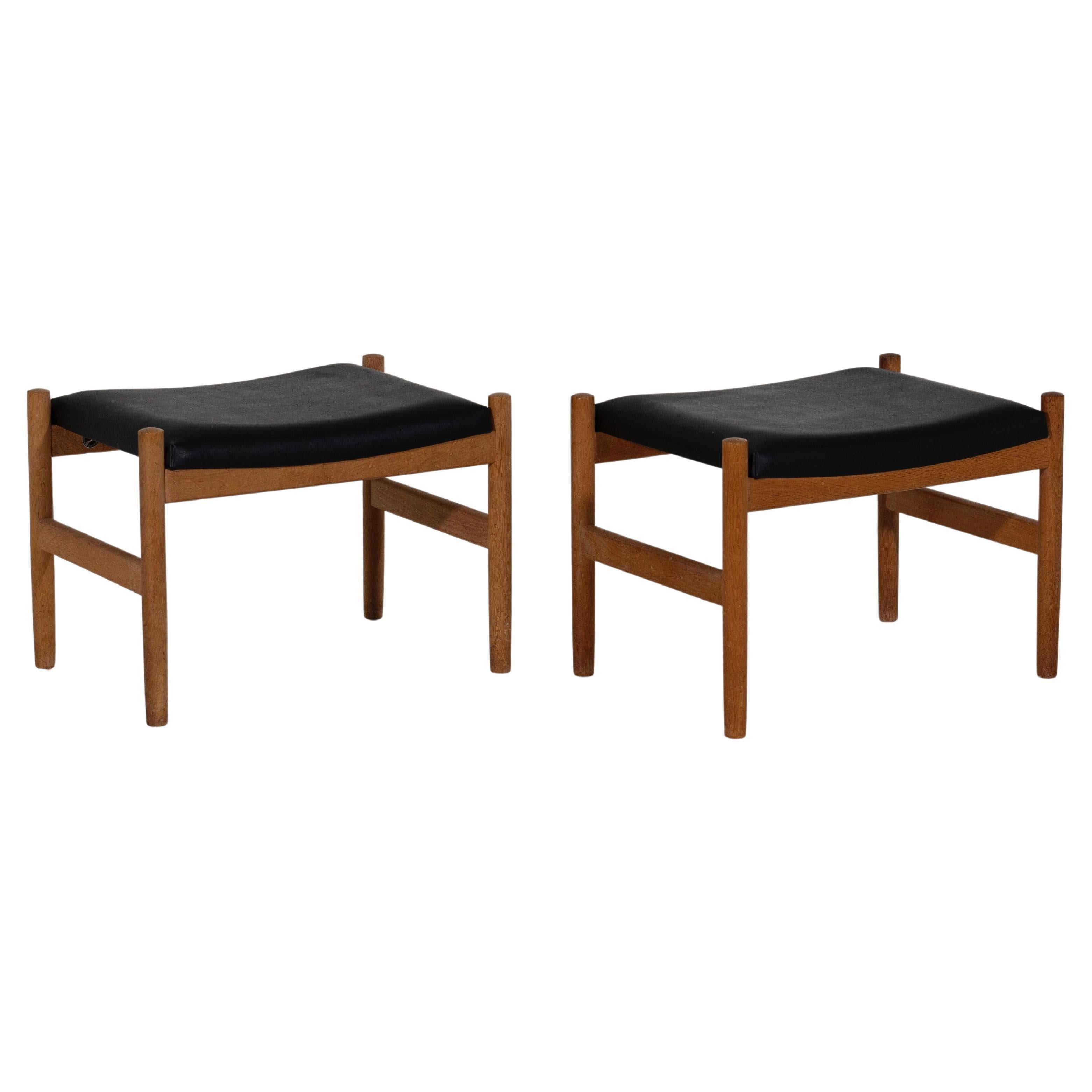 Pair of Danish stools with leather seats, signed, 1960´s.