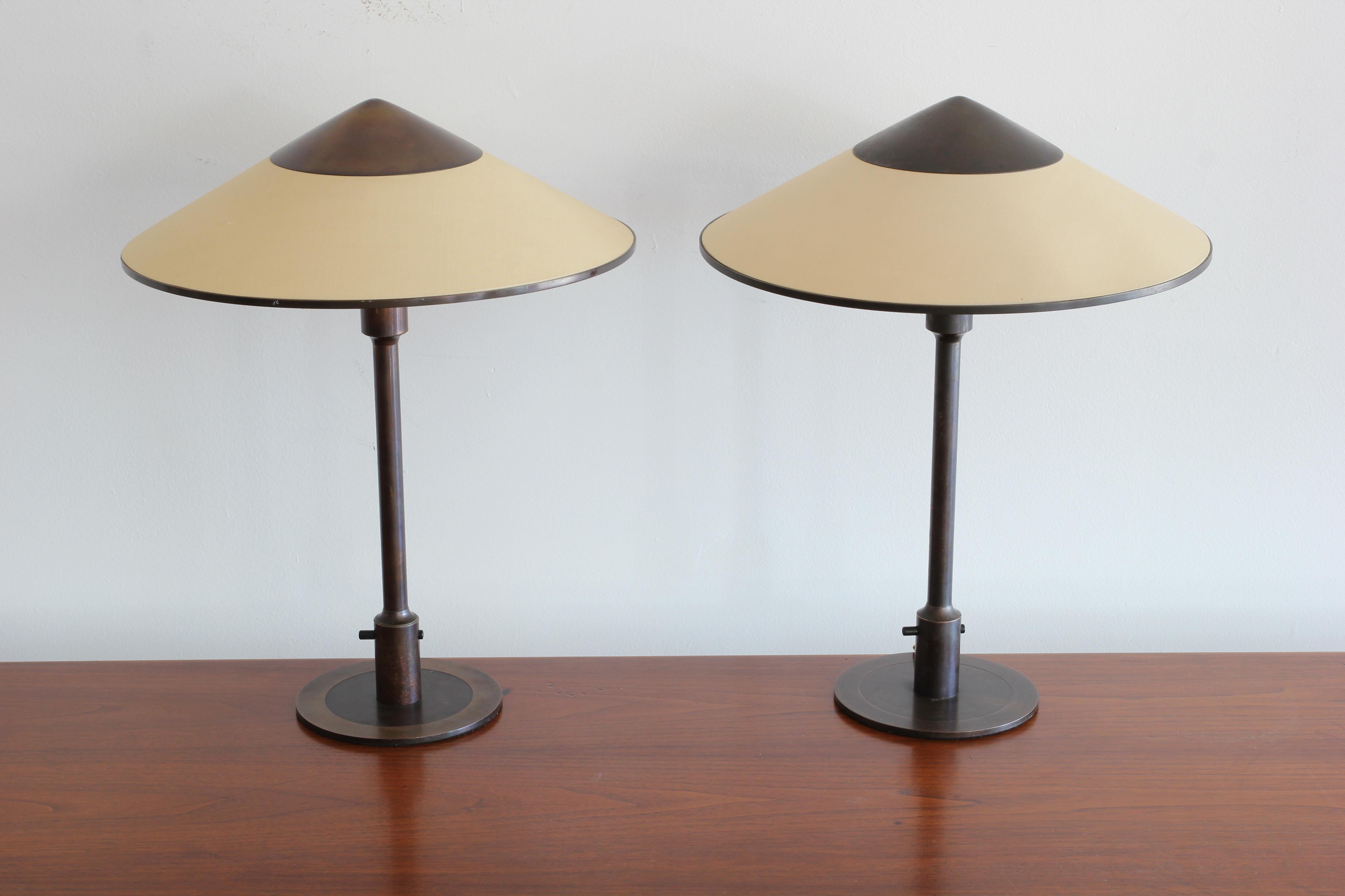 Incredible burnished bronze table lamp with cone shade called the Kongelys Lamp by Niels Rasmussen Thykier for Fog & Mørup. Original metal fittings on shades. 

Slight variations in each. Could be sold individually.