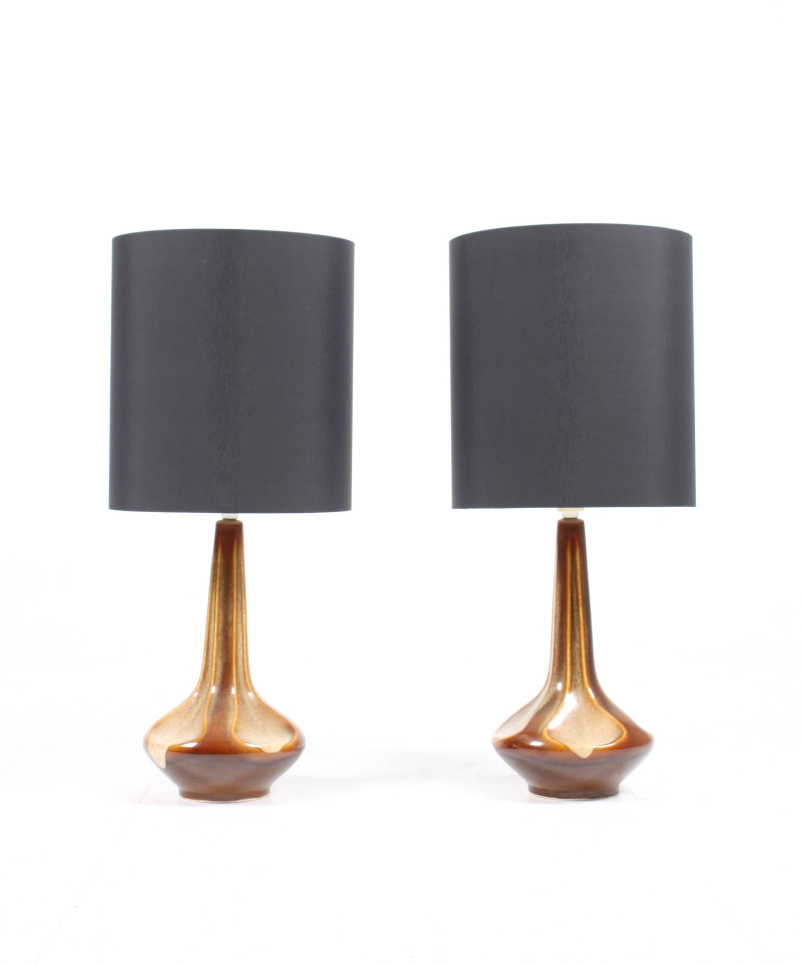 Pair of Danish table lamps designed by Søholm Studio in the mid-1960s. This lamp is a fine example of the Danish ceramics made on the island Bornholm. Great condition.
