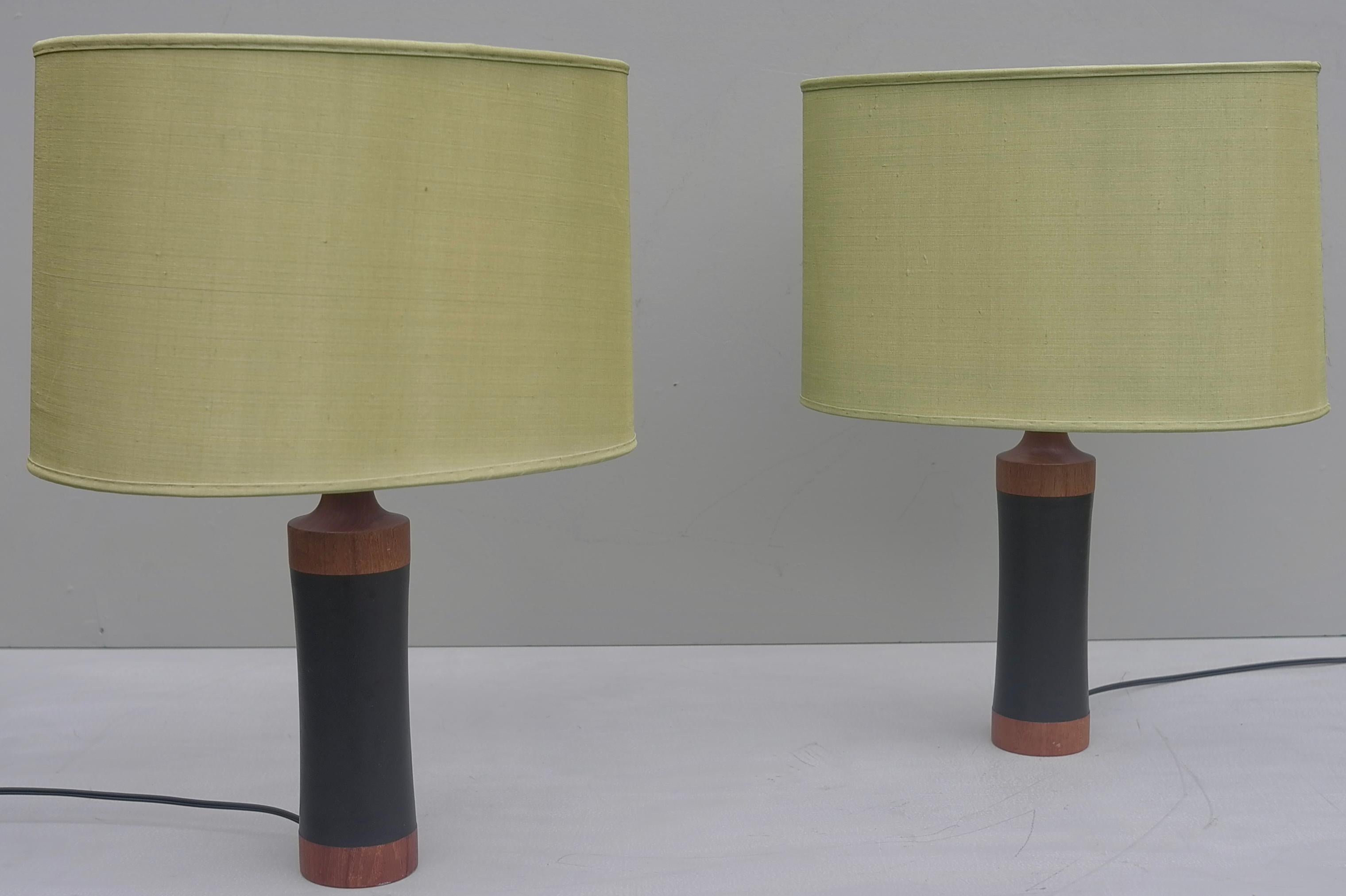 Pair of Danish teak and black leather table lamp with green silk lampshades.