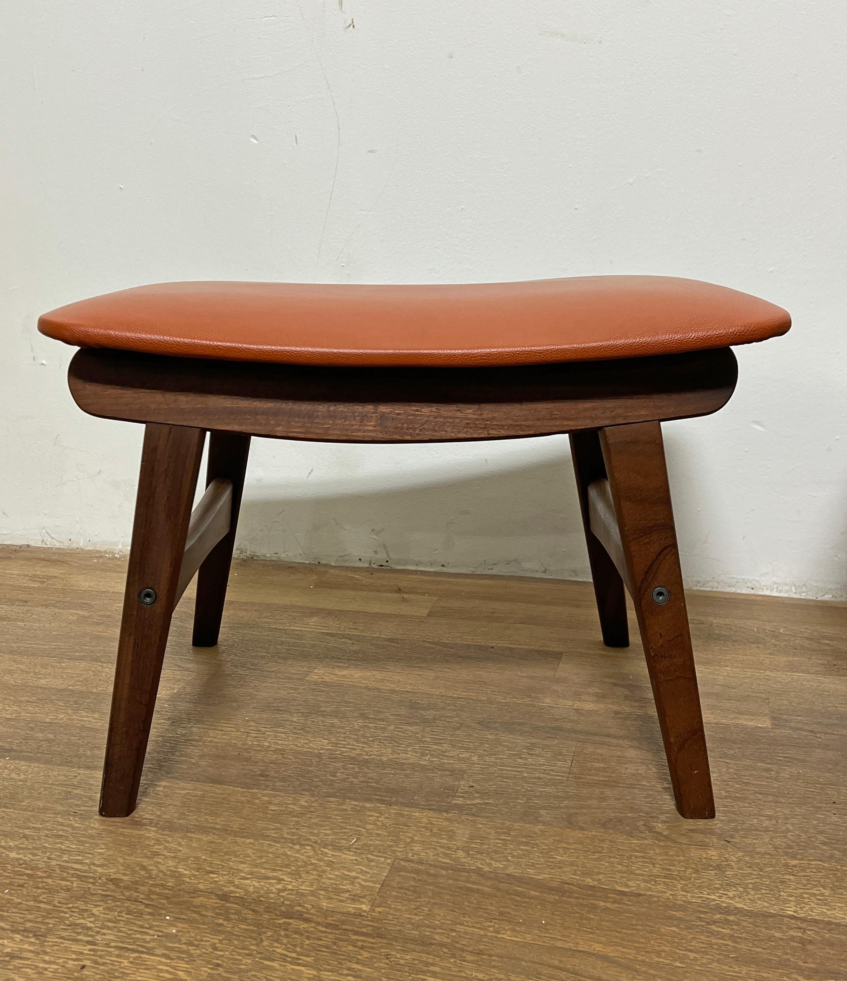 Pair of sculptural teak stools with leather upholstery by Fredly Mobelfabrik, Denmark, circa 1960s.