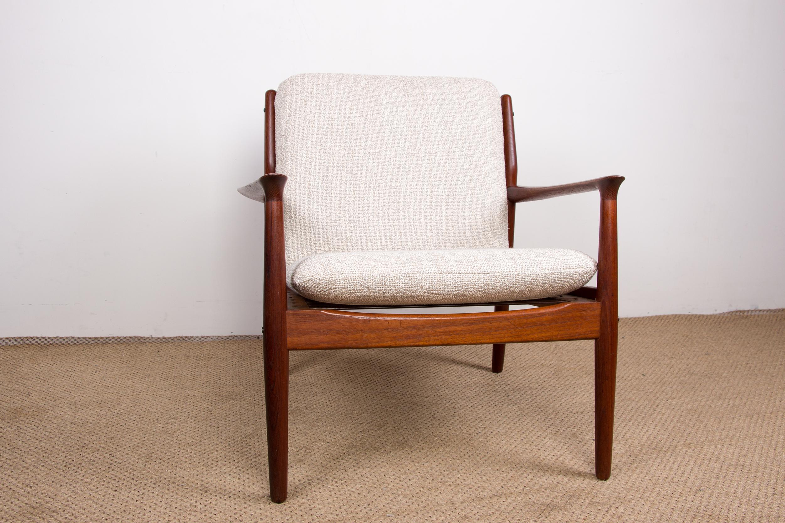 Two superbly made Scandinavian armchairs with a very elegant slender design. The seats and backs have been redone in very good quality cream terry fabric. A sofa from the same set can be found on another Furniture ad listed at Design Museum Denmark