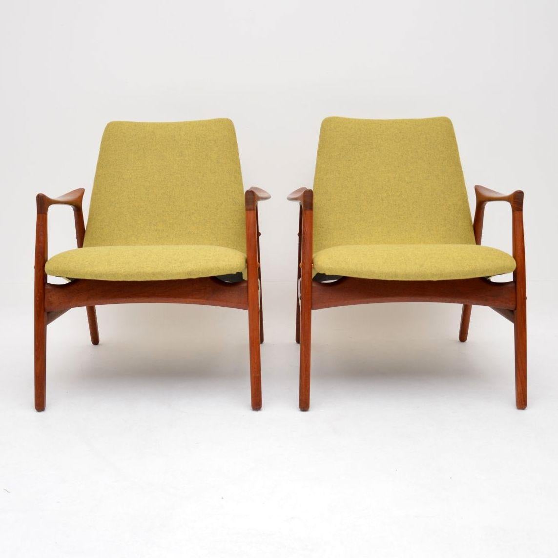An absolutely stunning and extremely rare pair of Danish teak armchairs, these were designed in 1958 by Arne Hovmand-Olsen, they were made by Mogens Kold. These are extremely comfortable as well as stylish, they are in amazing condition for their