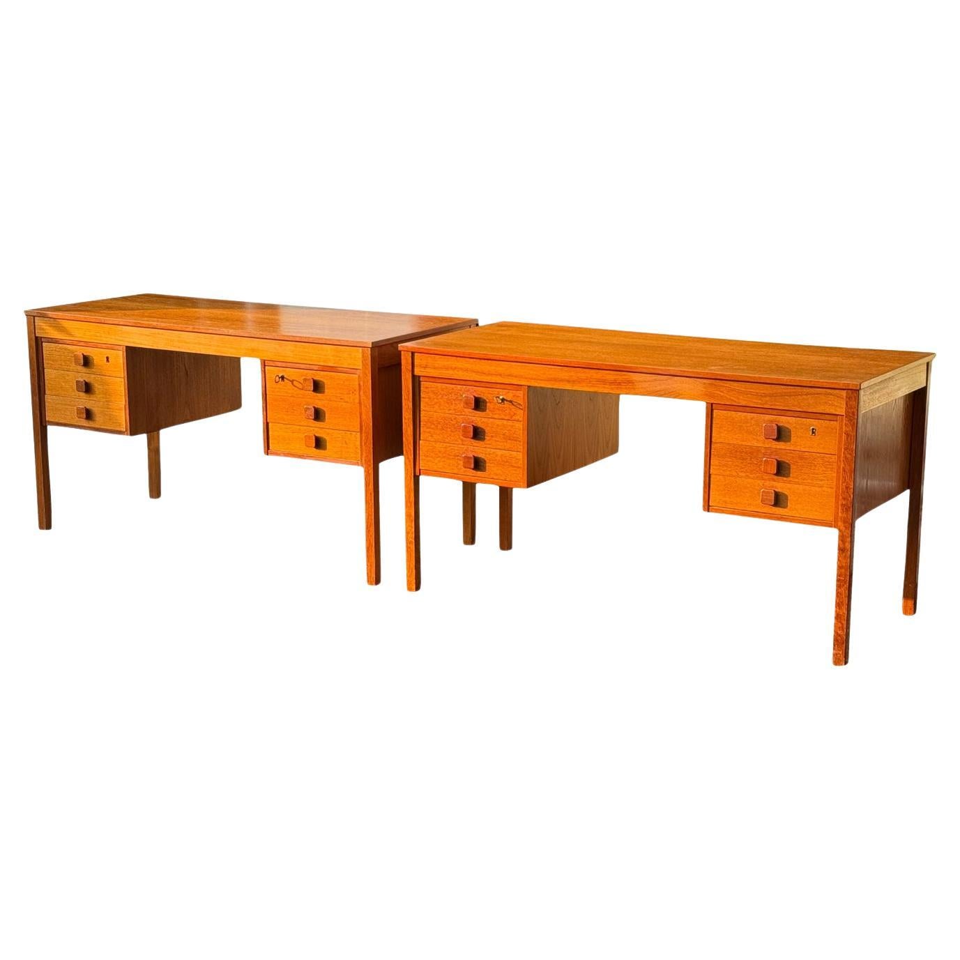 Pair of Danish Teak Matching Desks with Lock 
Key by Domino Mobler en vente