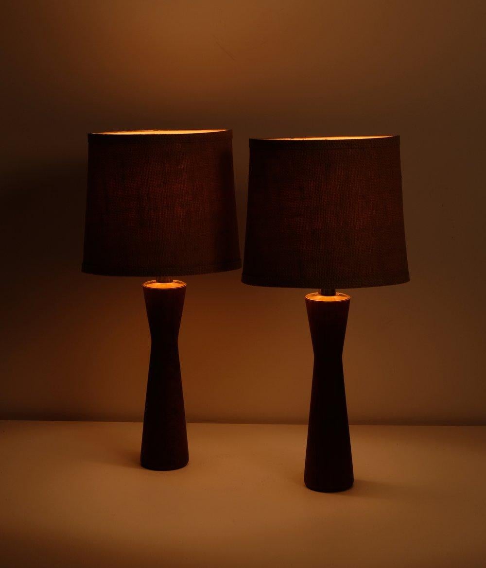 Pair of Danish Teak Table Lamps, 1960s. 40 watts E-26 medium base incandescent bulb recommended or higher if LED/CFL.

Rewired with E-26 medium base socket, original brown plastic cord, non-polarized north American plug. Original jute shades are