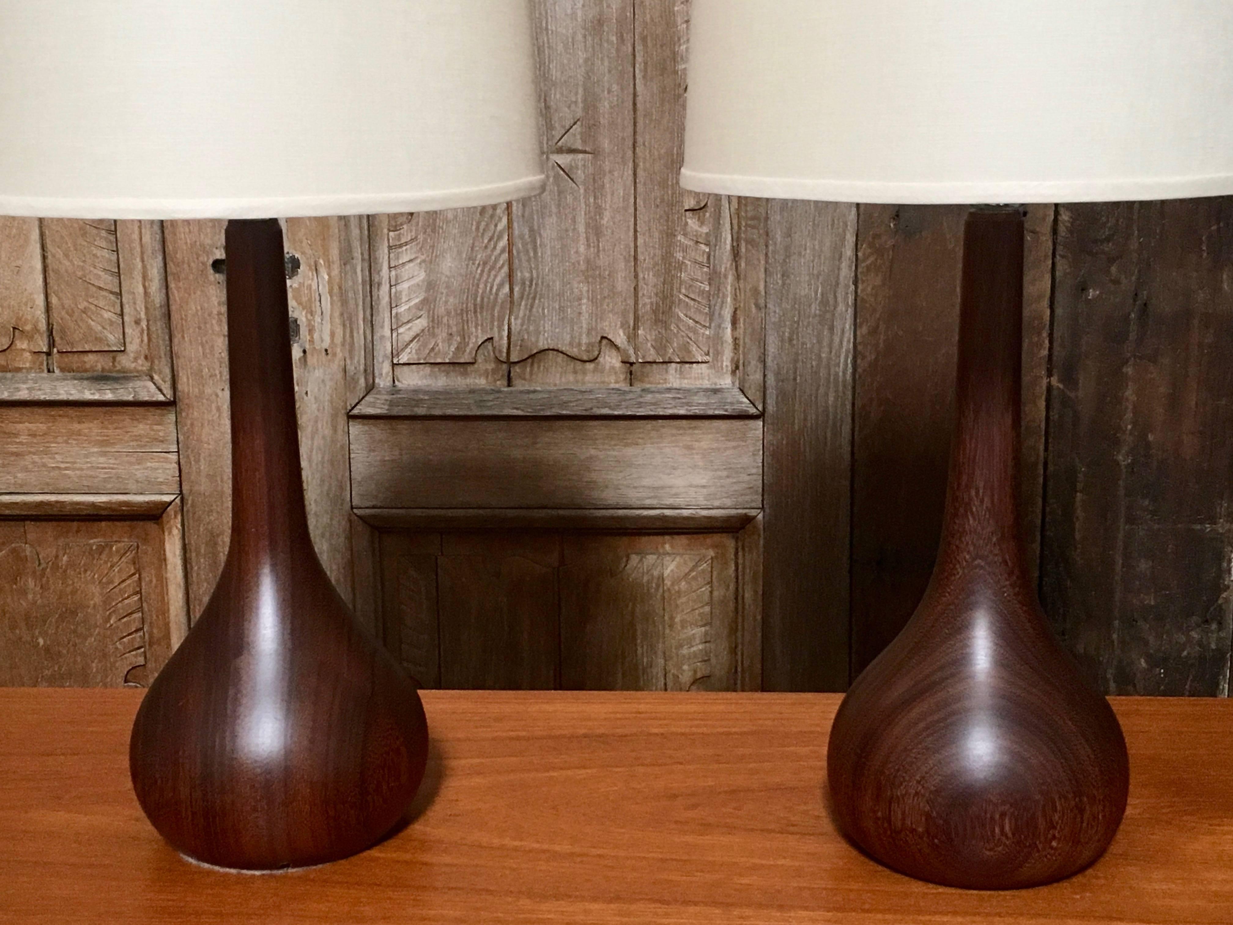 Dark teak onion shaped table lamps with new shades.