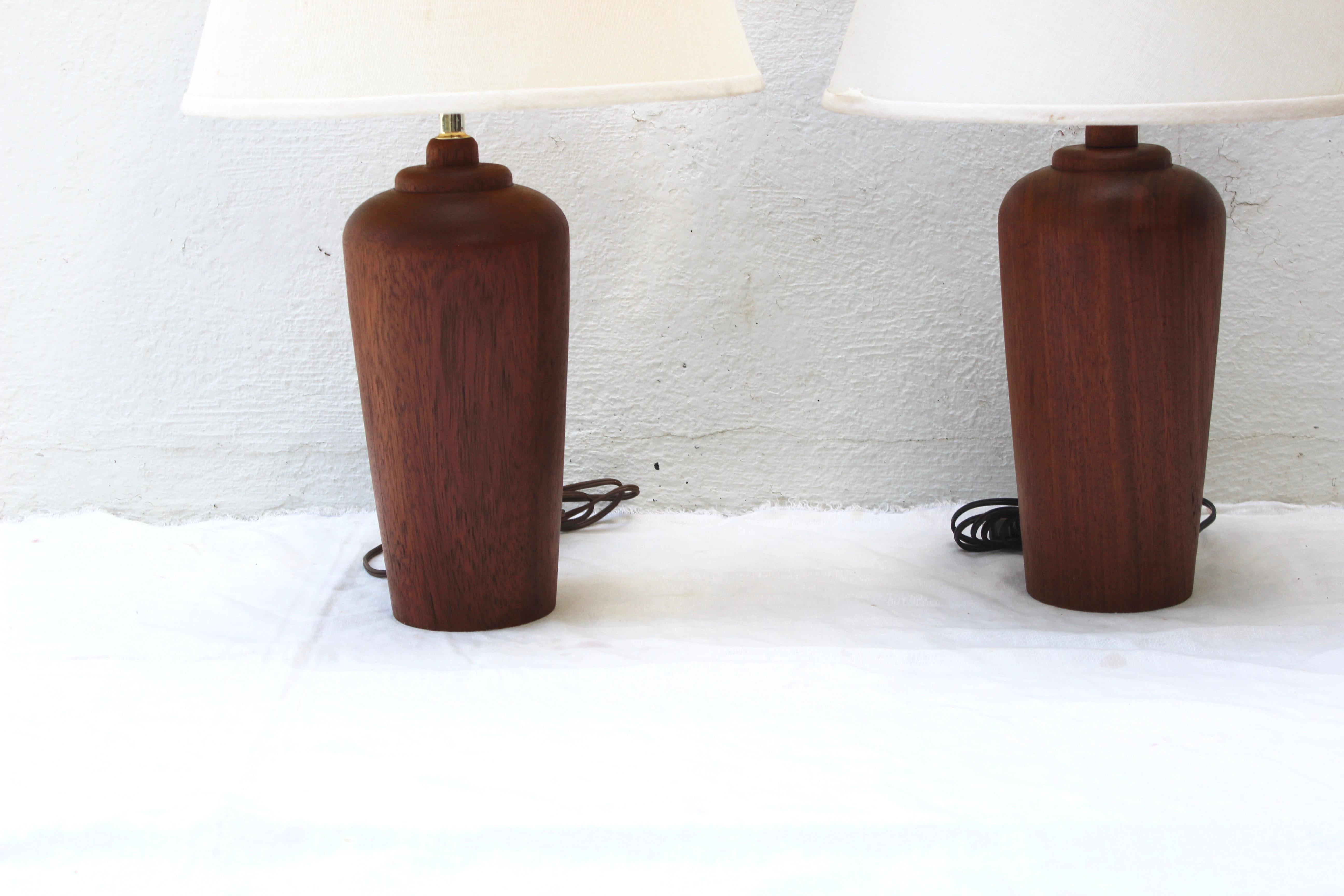 Pair of modern Danish teak lamps. Photographed shades not included.
