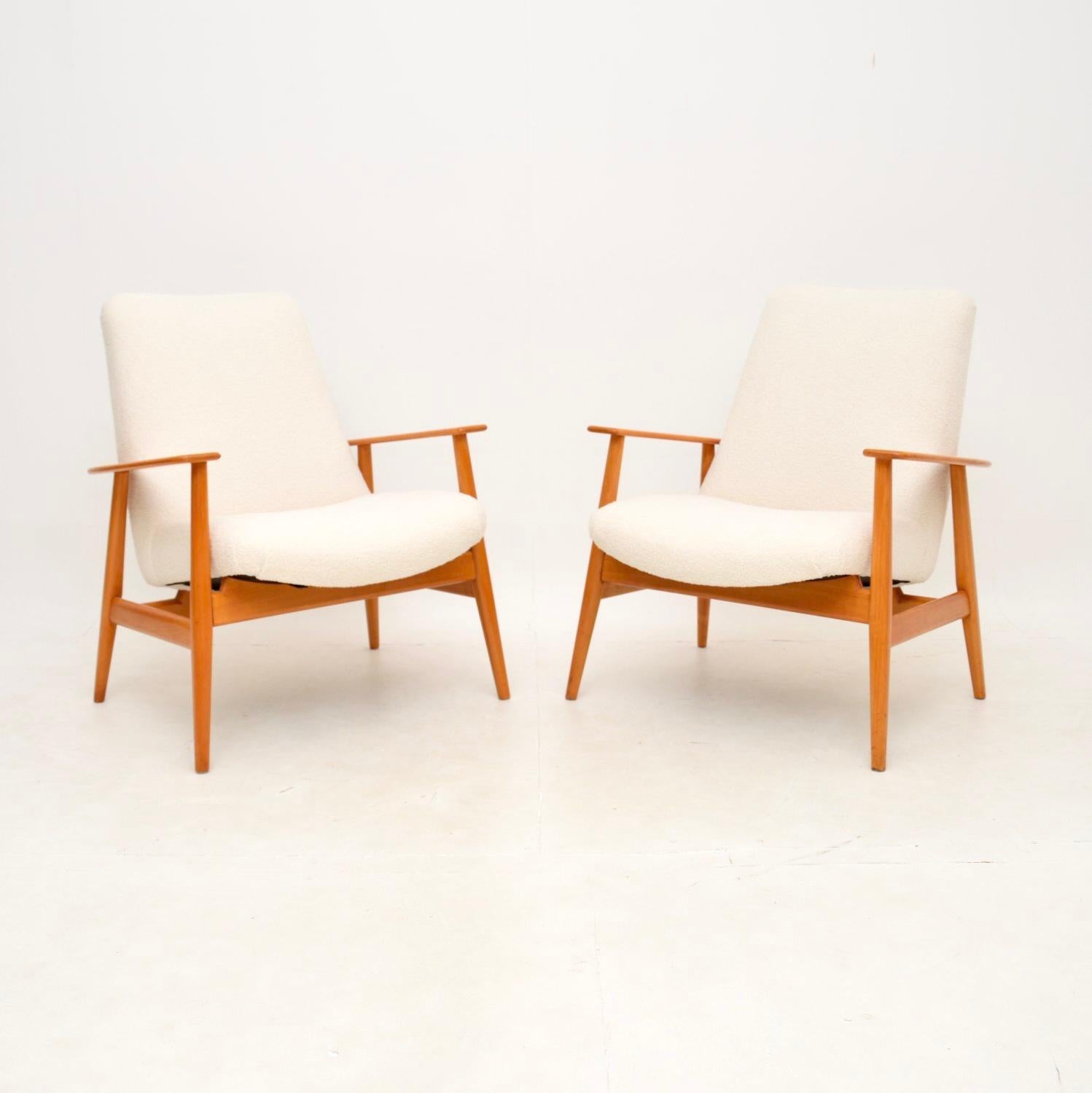 A stylish and extremely well made pair of Danish vintage armchairs in Cherry wood. They were recently imported from Denmark, they date from the 1950-60’s.

They are of amazing quality and are very comfortable. They look amazing from all angels, with
