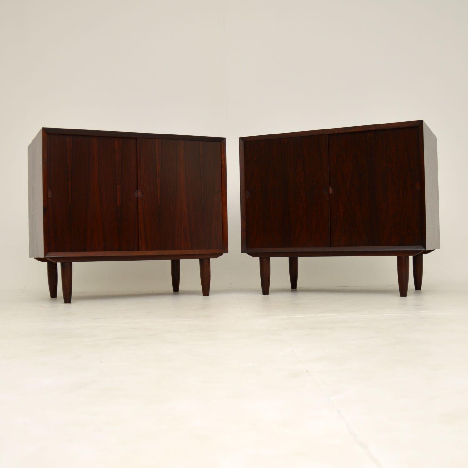 A stunning pair of vintage Danish cabinets made in Denmark in the 1960’s. They were designed by Poul Cadovius.

They are of absolutely amazing quality, with beautiful wood grain patters throughout. Even the interiors have gorgeous wood grain, on