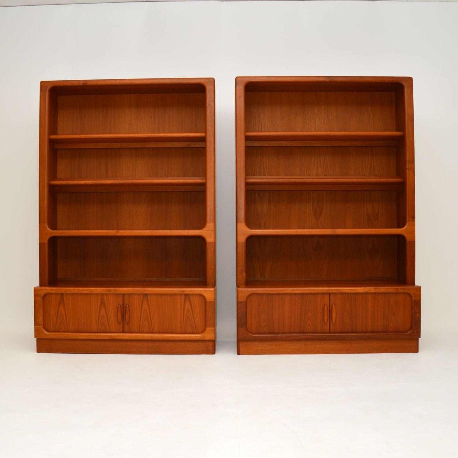 A stunning pair of large Danish bookcases in solid teak. These were made by Dyrlund, they date from the 1970-80’s.

The quality is absolutely amazing, these are so well made and are very useful. They have tambour doors in the lower sections, the