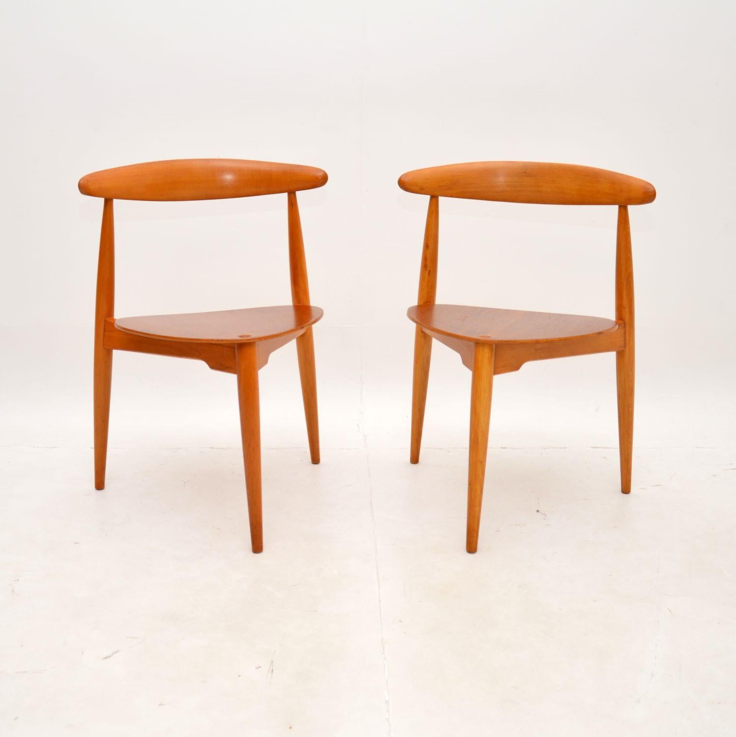 A stunning and extremely well made pair of Danish vintage teak heart chairs by Hans Wegner. They were made in Denmark by Fritz Hansen, they date from the 1950’s.

The quality is outstanding, they stand on three tapered legs, they are remarkably
