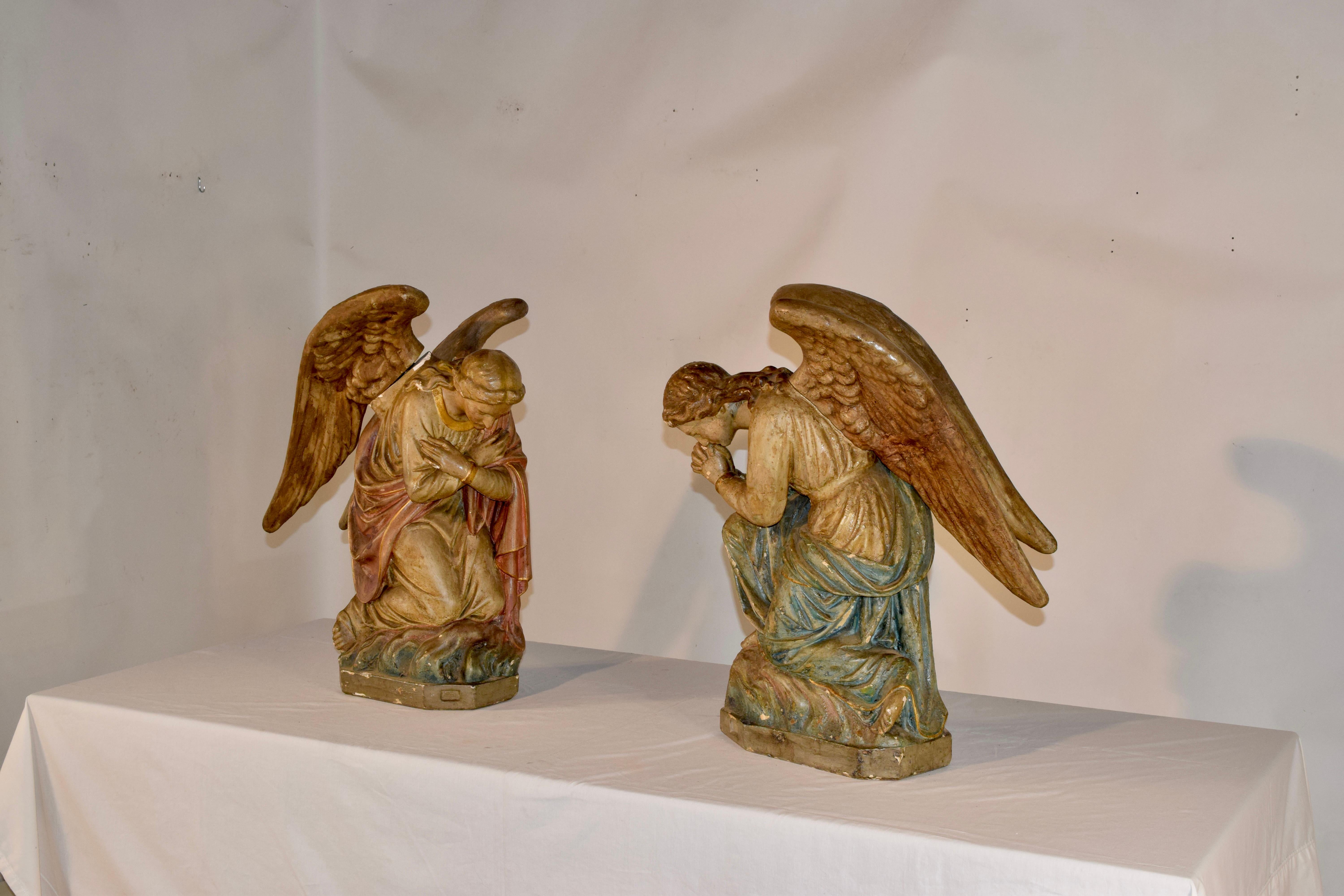 These stunning angel sculptures are sold as a pair. They were originally placed on an church altar, with one facing left and the other facing right. With their detailed facial features and sweeping wings, they are truly captivating works of art.