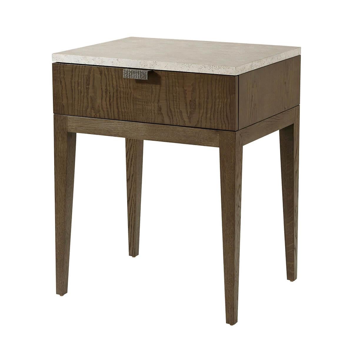 A modern single drawer nightstand perfect for any bedroom. Seen here in clean-cut figured ash in our dark earth finish with a textured metal pull in Ember finish. Completed with a stone-like porous top in our exclusive Mineral finish.

Dimensions: