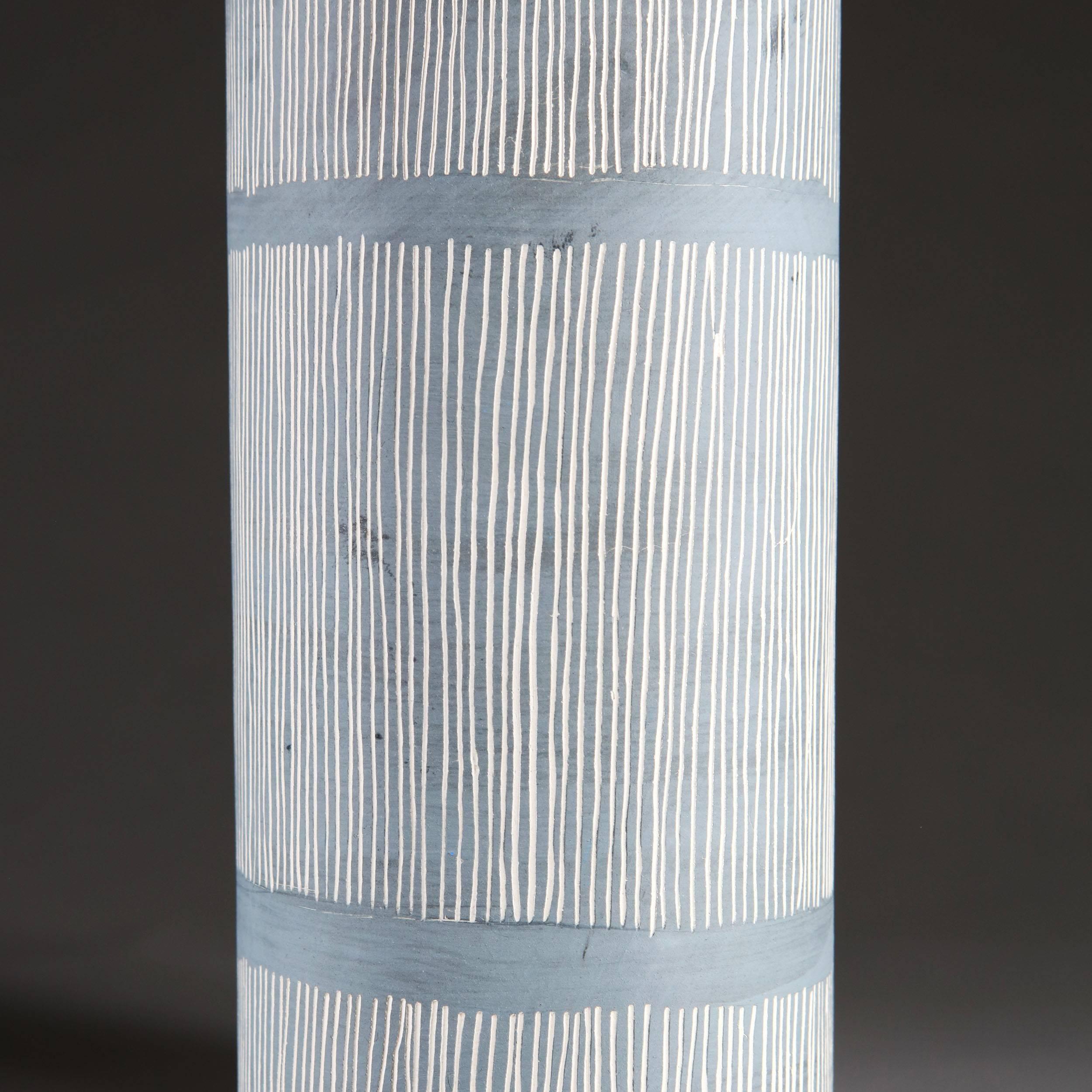 A pair of Studio Pottery cylindrical vases, now converted as lamps, with blue and white striped glaze.

Currently wired for the UK. Please enquire for rewiring services. 

Please note: Lampshades not included.