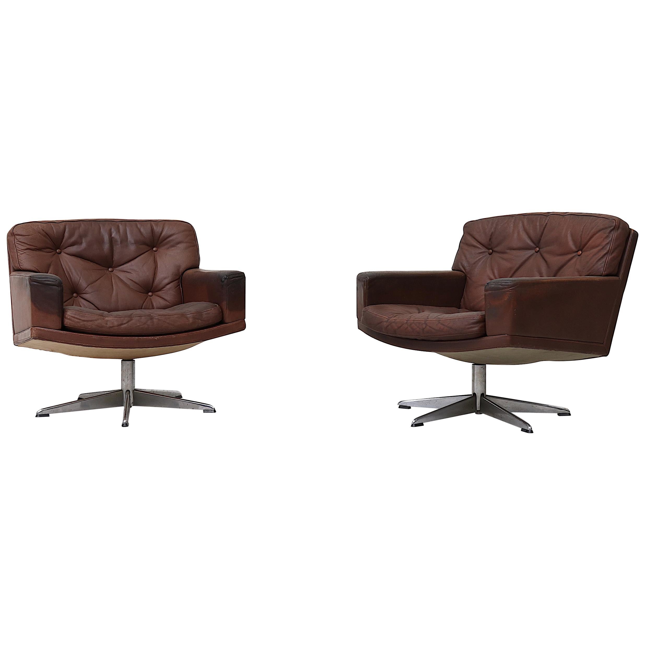 Pair of Rhône Dark Leather Swivel Lounge Chairs at 1stDibs