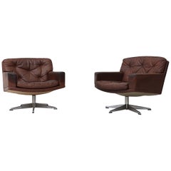Pair of Rhône Dark Leather Swivel Lounge Chairs