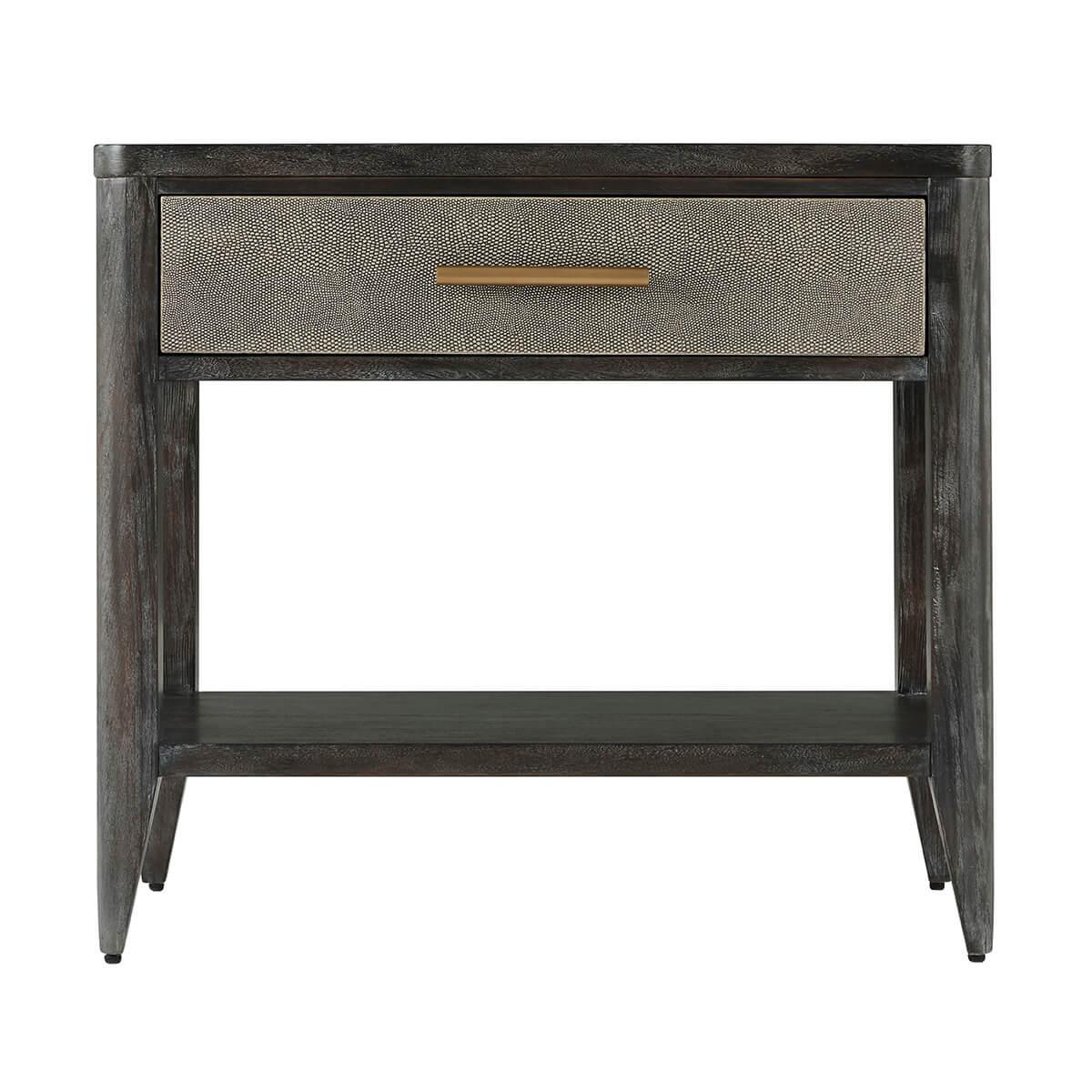 with Komodo embossed leather sides. The rectangular bedside table has a soft-closing single drawer with a brushed brass handle, curbed corners and a lower shelf stretcher base.

Dimensions: 28