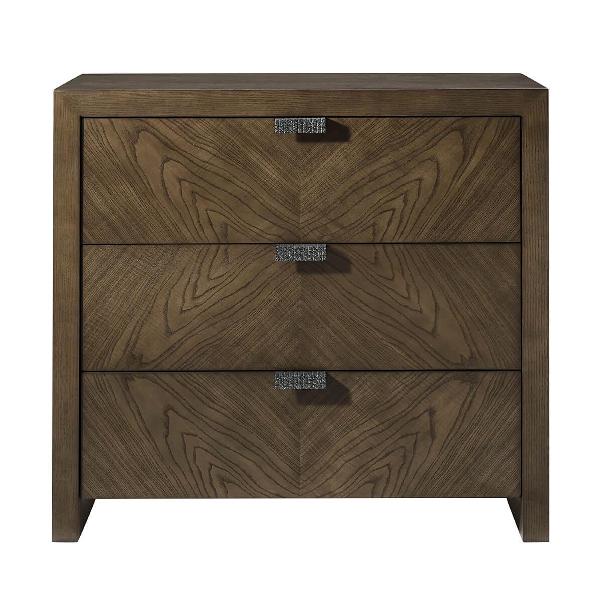 three drawer nightstand made of figured cathedral ash in artful grain patterns of our dark earth finish with textured metal pulls in our Ember finish and soft close drawers.

Dimensions: 32
