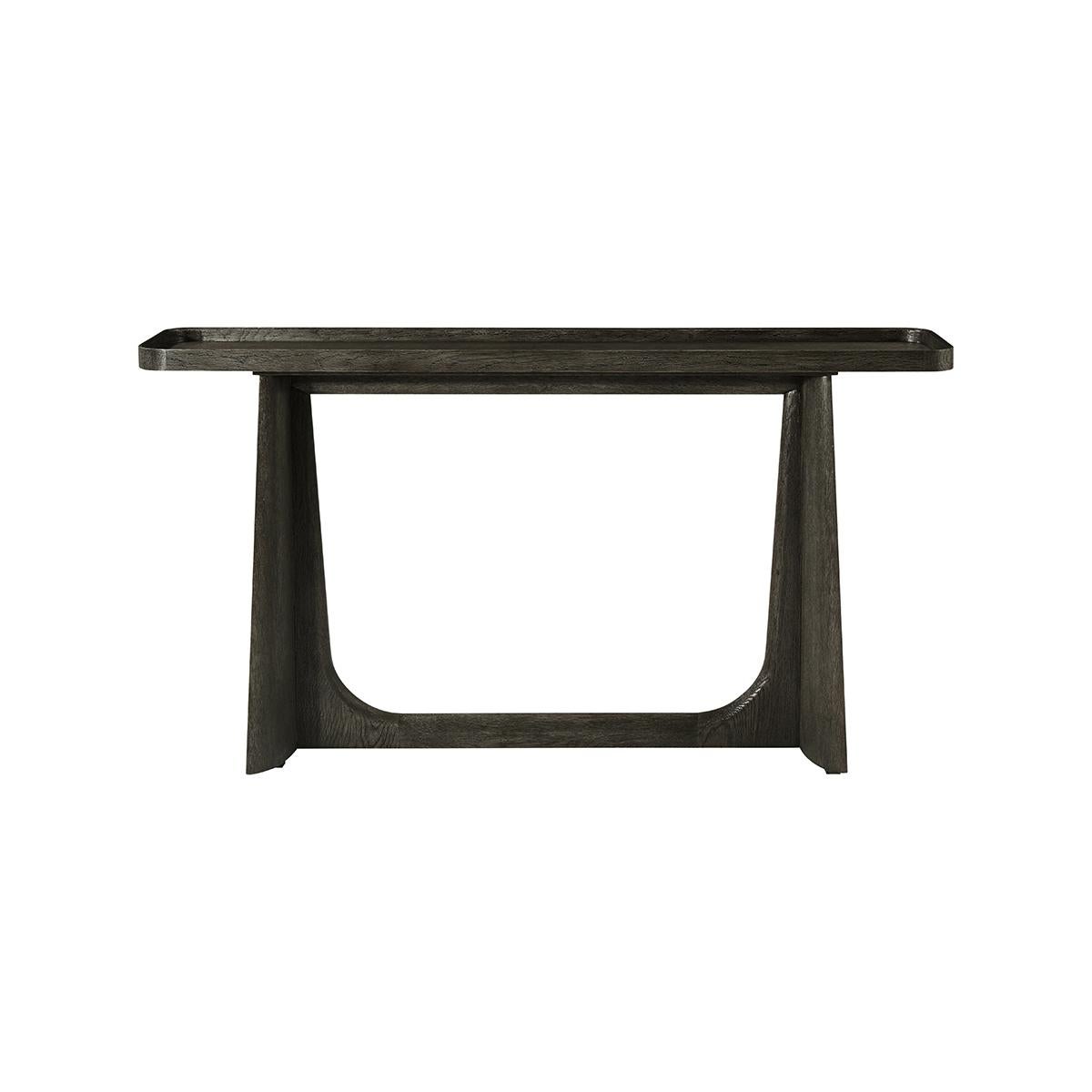 Featuring a wire-brushed white oak in our dark Charcoal oak finish. With deep dish galleried top raised on trapezoidal form trestle ends with a stretcher.

Dimensions: 60