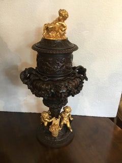 Pair of Dark Patinated Bronze Urns with Gilt Bronze Putti Caps, Baccanal Mask