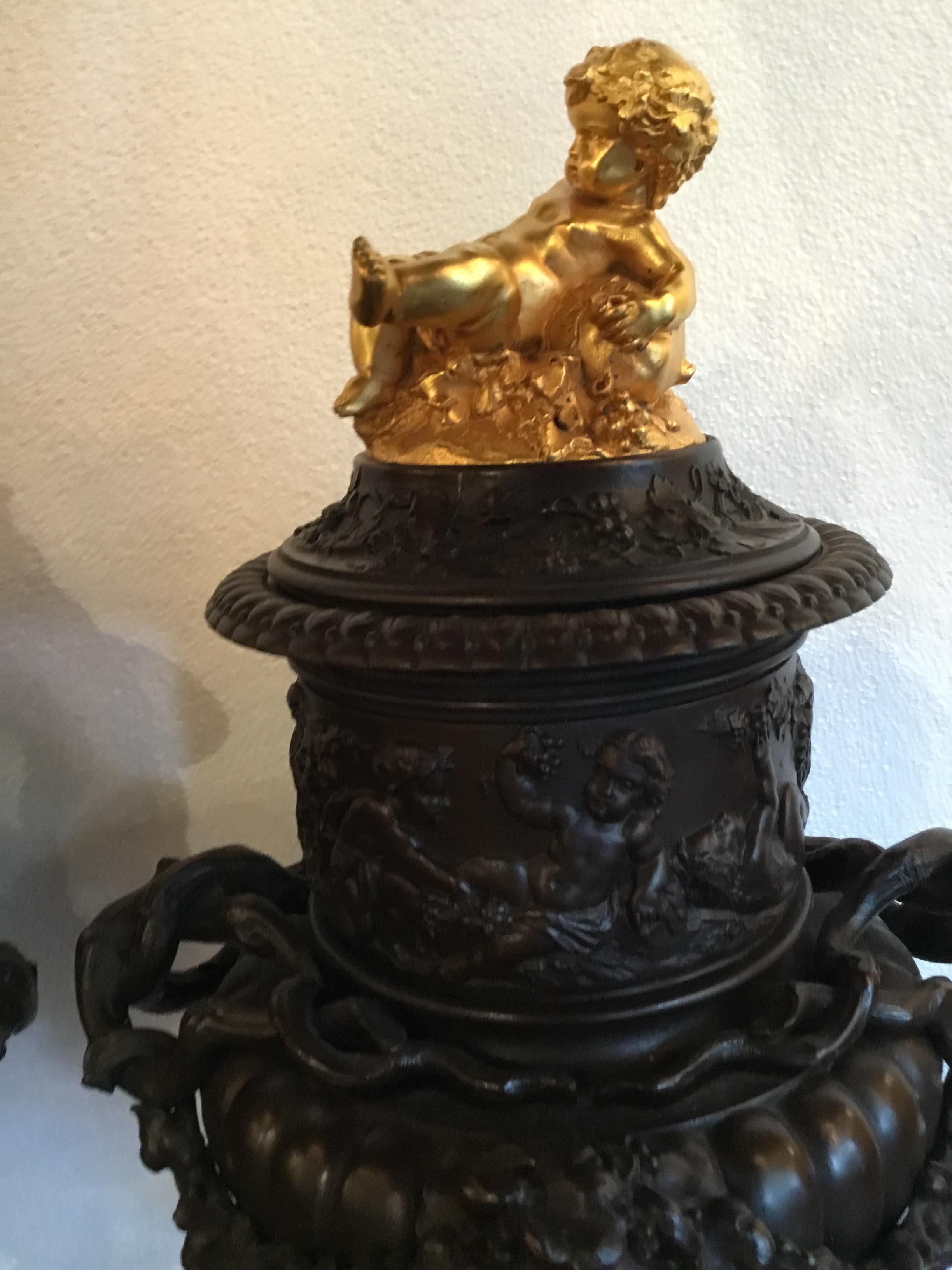 Pair of Dark Patinated Bronze Urns with Gilt Bronze Putti Caps, Baccanal Mask 3