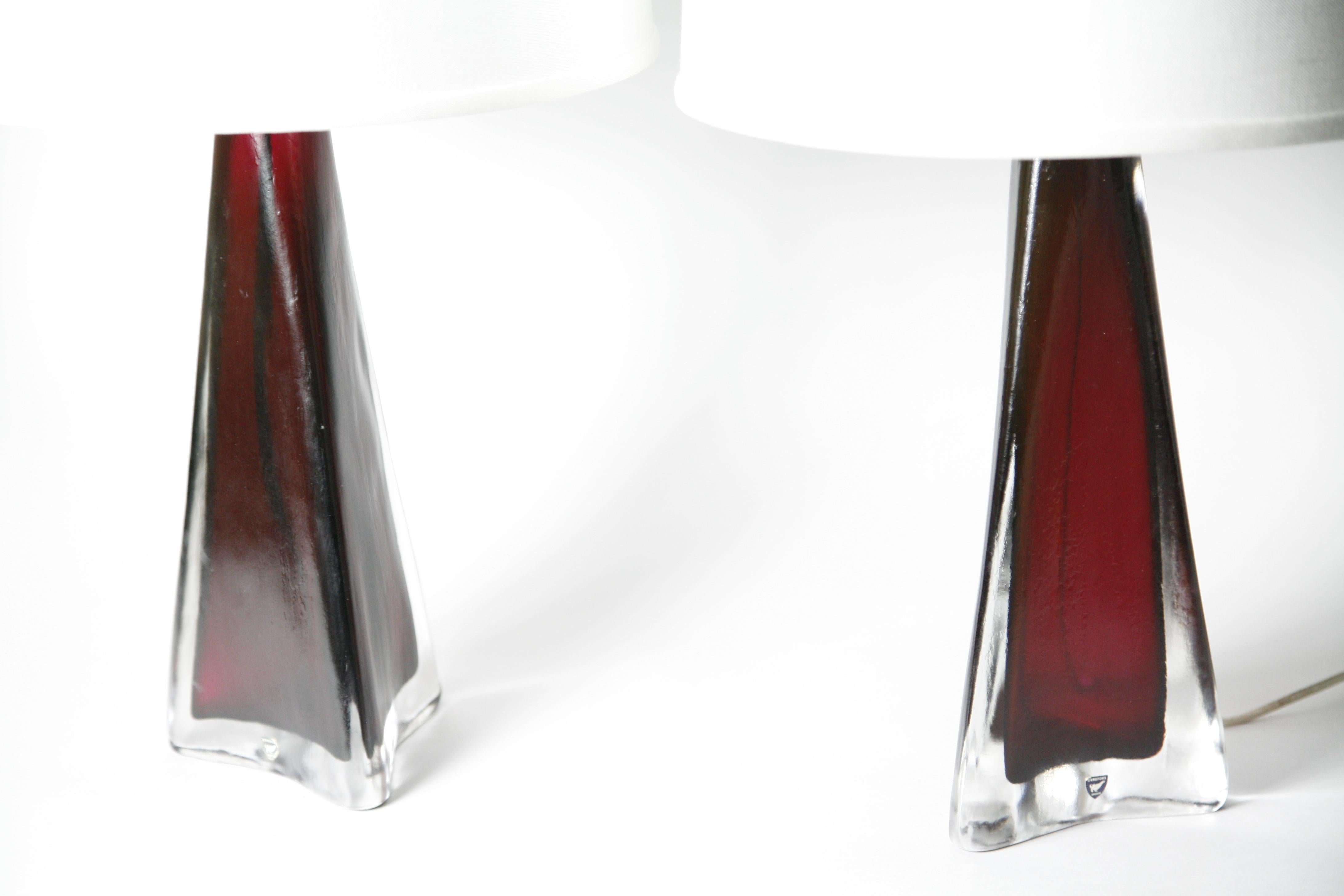 Ruby red pair of crystal lamps encased in a layer of frosted clear glass with brass fitting By Carl Fagerlund for Orrefors 1960.
Original stickers still present , signed on the bottom.

Can be rewired for the US.

Shades not included.