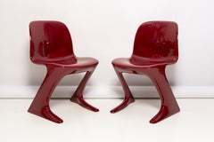 Pair of Dark Red Wine Kangaroo Chairs Designed by Ernst Moeckl, Germany, 1968