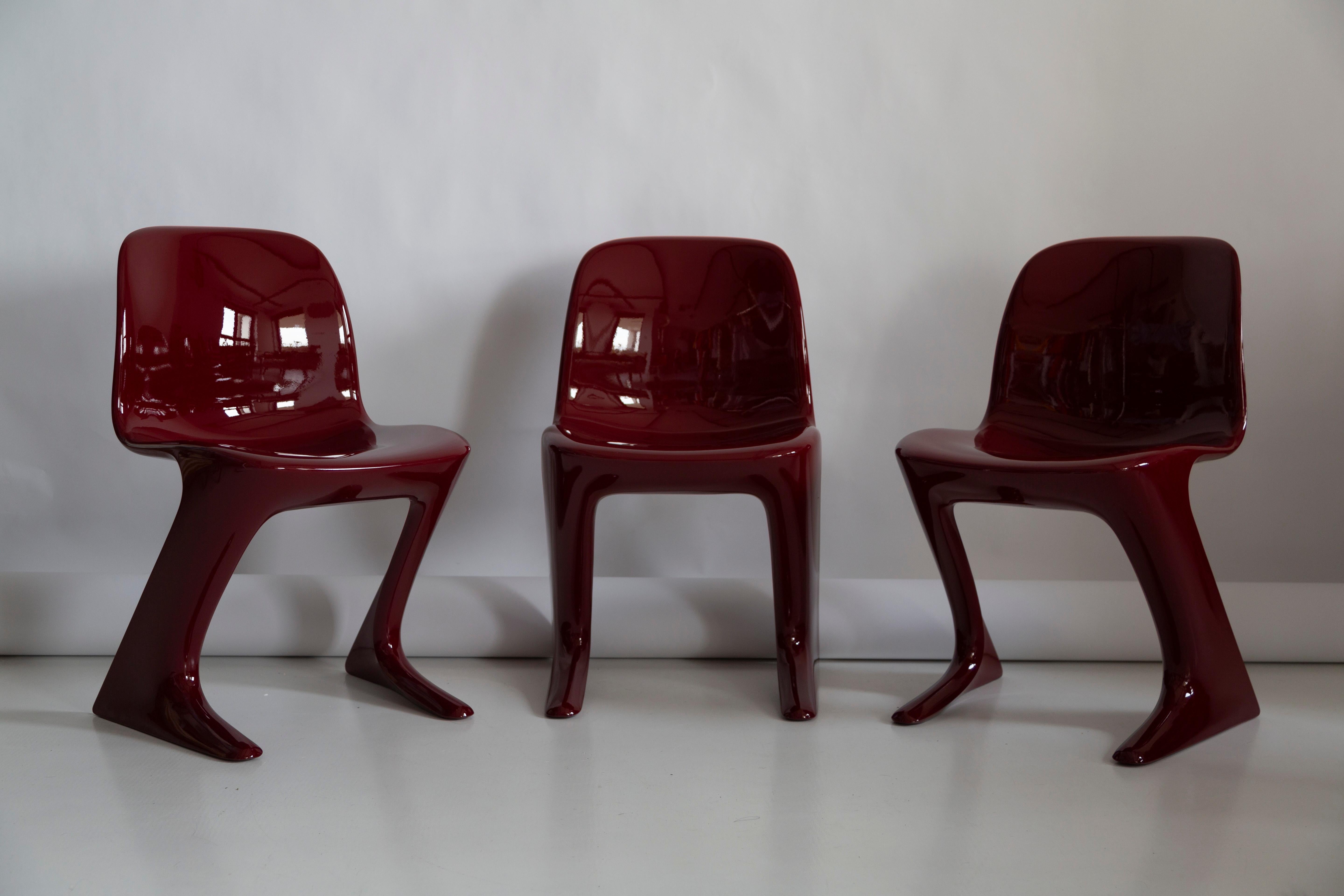 Mid-Century Modern Pair of Dark Red Wine Kangaroo Chairs Designed by Ernst Moeckl, Germany, 1968 For Sale