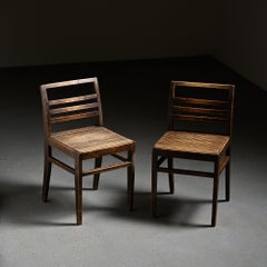 Pair of dark-stained beech chairs by René Gabriel, circa 1943