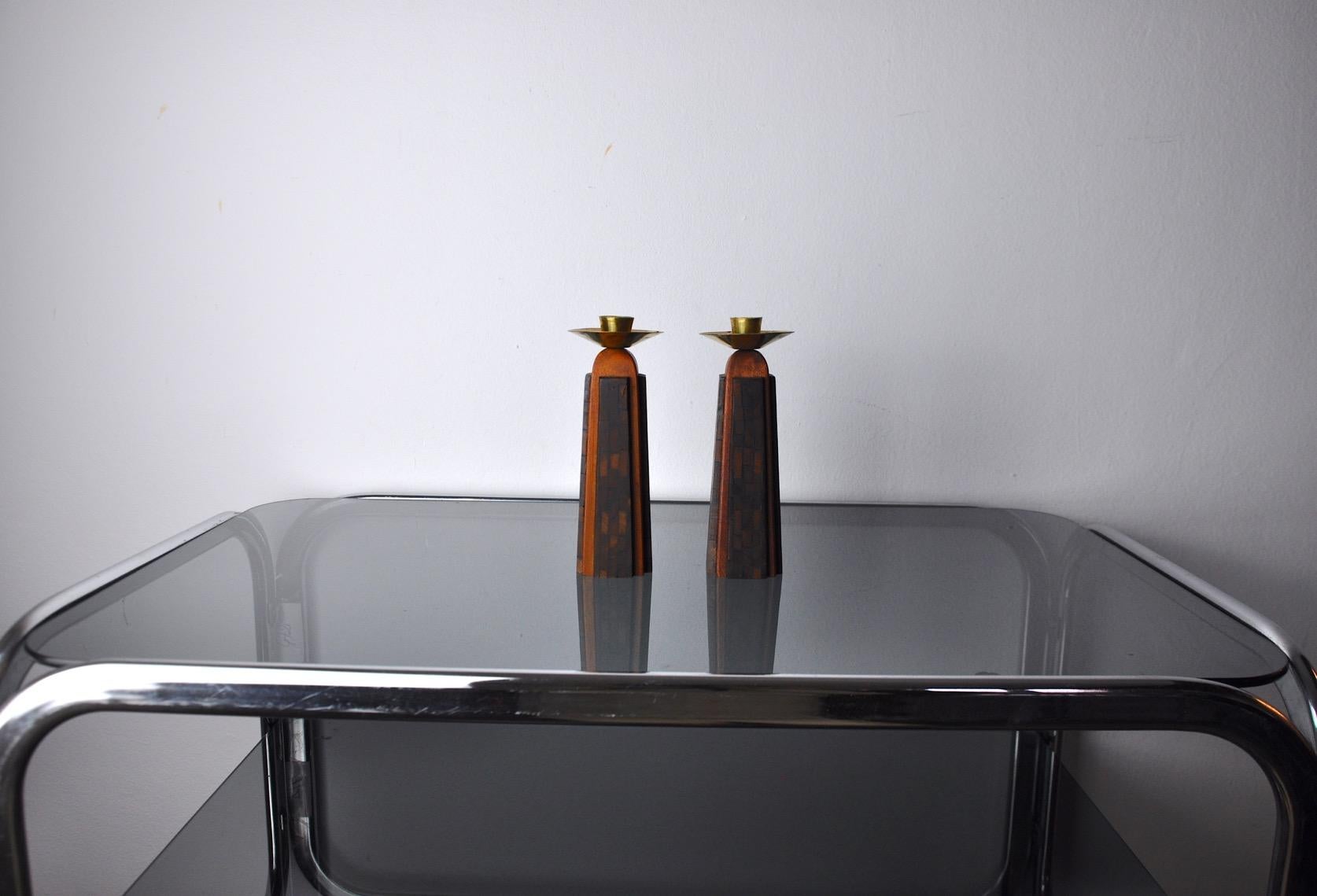 Very beautiful and rare pair of candlesticks designed and produced in Jerusalem in the 1960s. These two candlesticks consist of a beautifully hand-crafted olive wood structure and a brass upper part. Rare design object that will decorate your