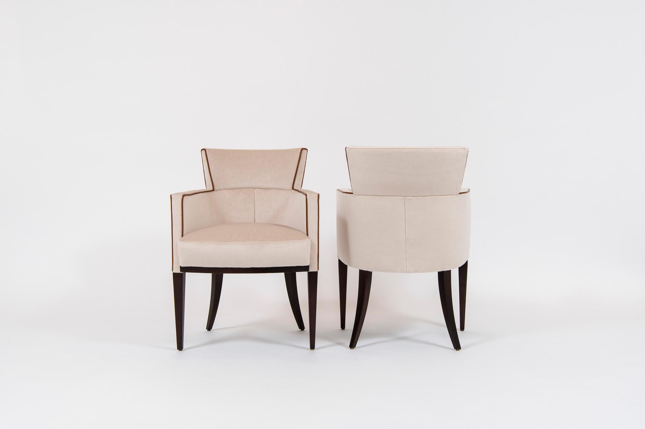 A pair of David Edward Gotham armchairs designed by Roger Crowley. These solid hardwood maple frame construction chairs are newly upholstered in an ecru Mohair silk velvet with an Italian cognac colored leather cord. 

 