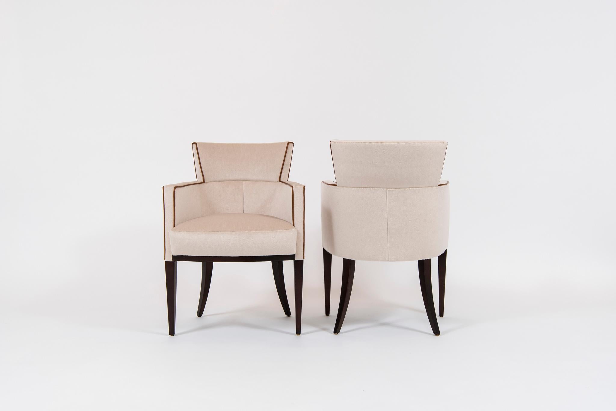 A pair of David Edward Gotham armchairs designed by Roger Crowley. These solid hardwood maple frame construction chairs are newly upholstered in an ecru Mohair silk velvet with an Italian cognac colored leather cord. 

