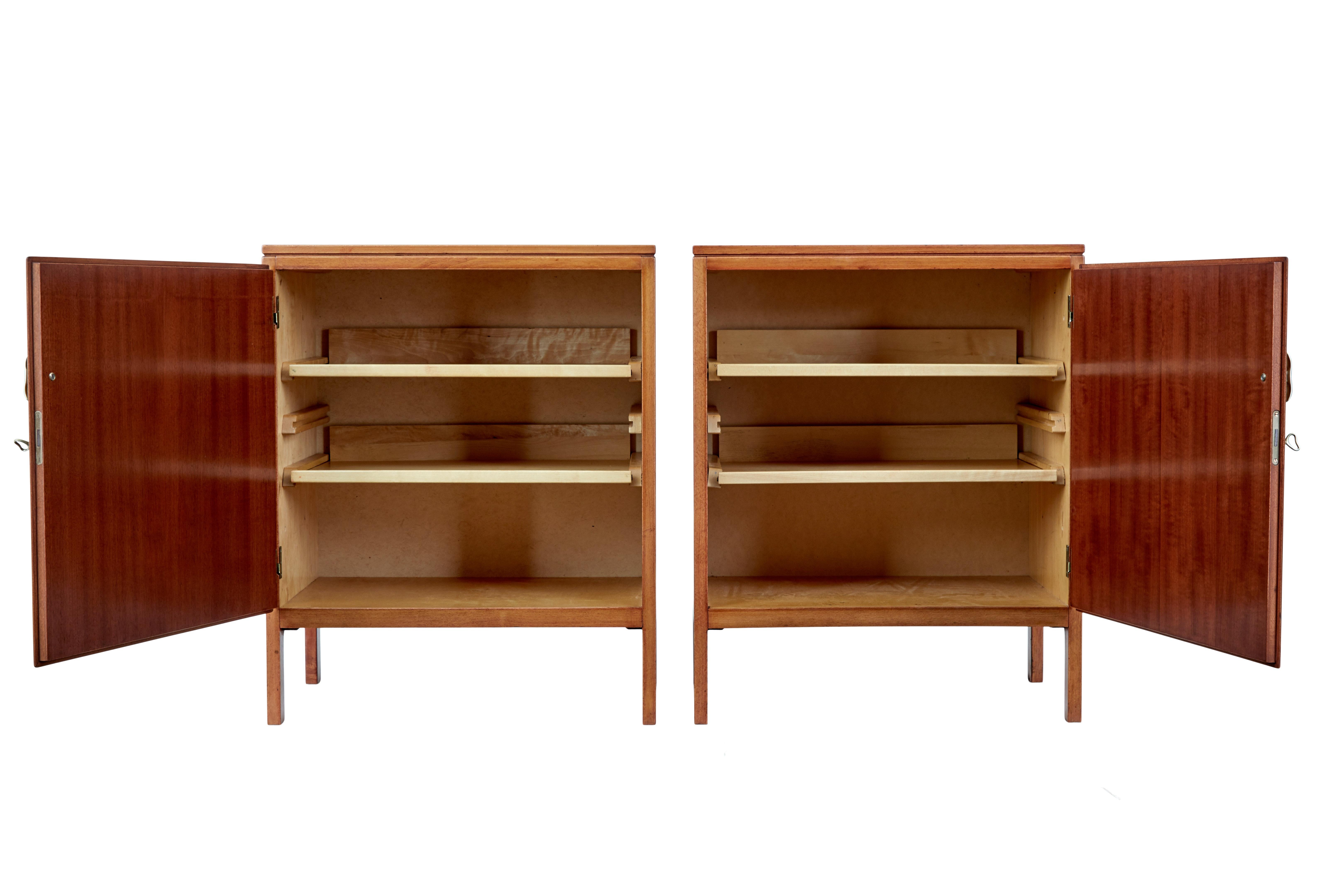 Pair of David Rosen 1950s mahogany cabinets for nordiska kompaniet circa 1955.

Designed by Swedish designer David rosen (1910-1993), Rosen was a well respected designer and was at his peak during the 1950's modern movements.

This pair of