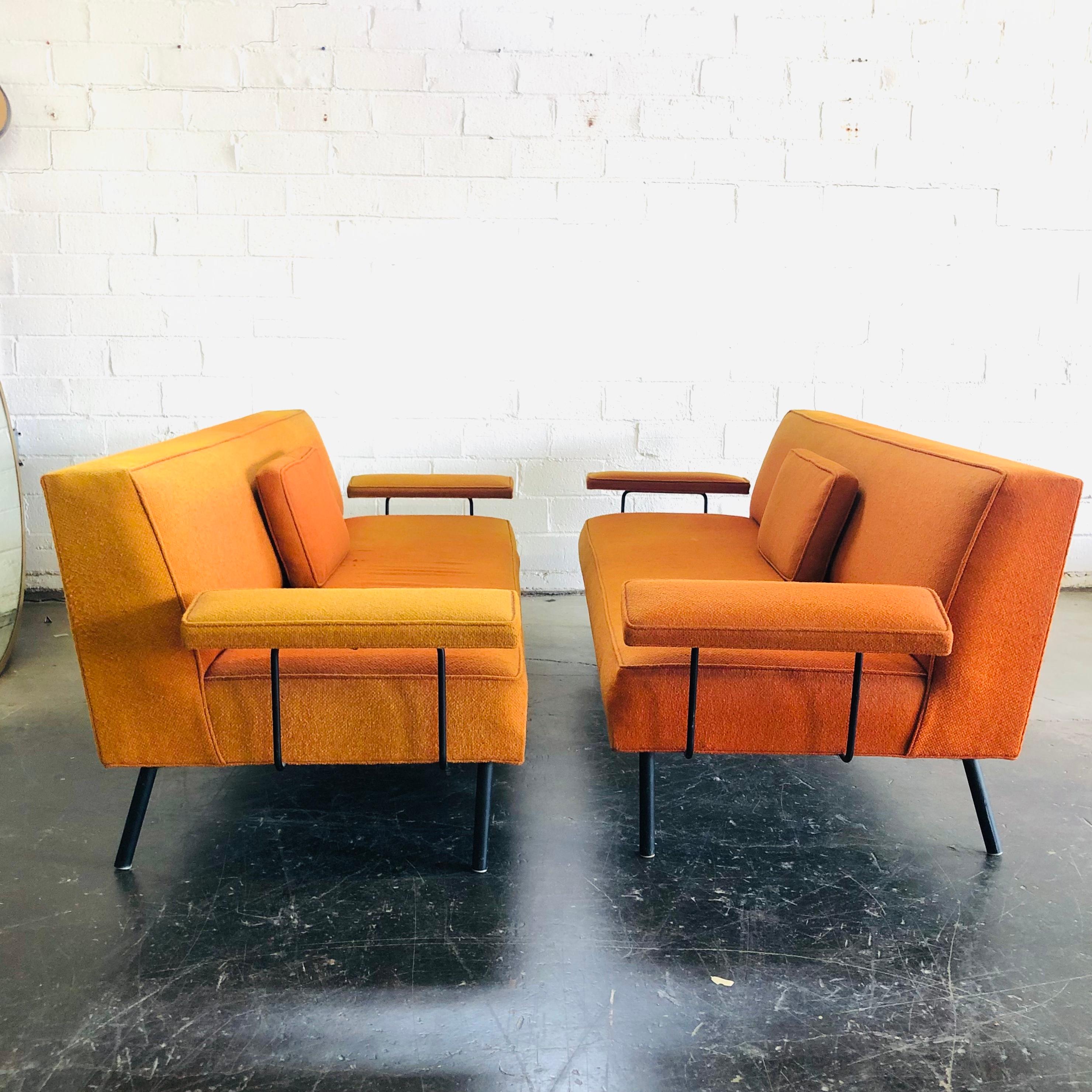 Stylish pair of vintage iron frame daybeds/sofas by George Nelson for Herman Miller. Good structural condition, upholstery shows wear and fading - reupholstery is recommended. 