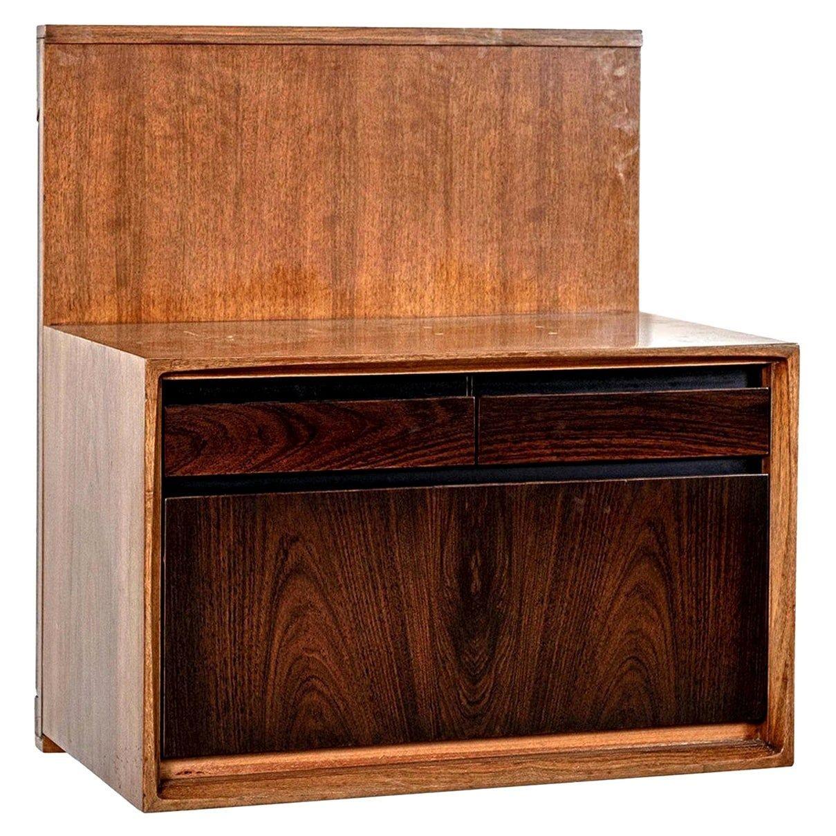 Pair of De Coene wall-mounted bedside tables in walnut and rosewood, mid-century consoles (1960) in veneered walnut, feature each two drawers and two-compartment drop front storage with solid rosewood fronts, framed by ebonized recessed accent. Made