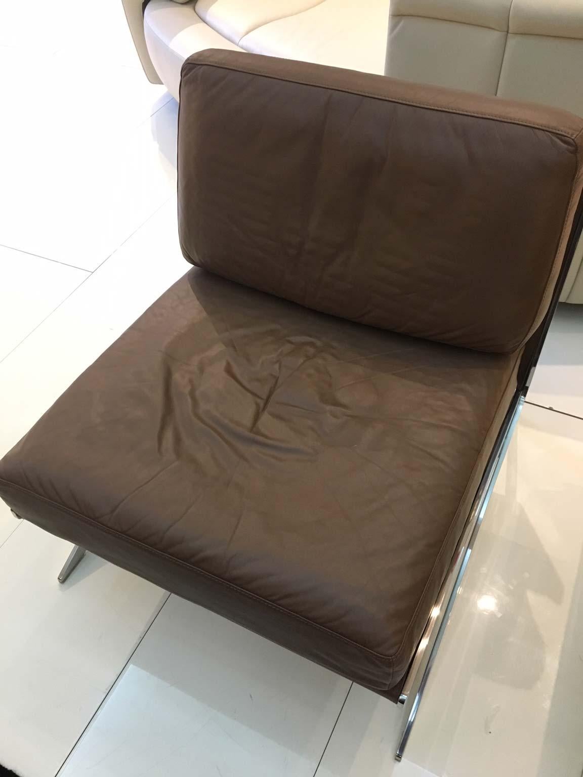 brown leather armless chair
