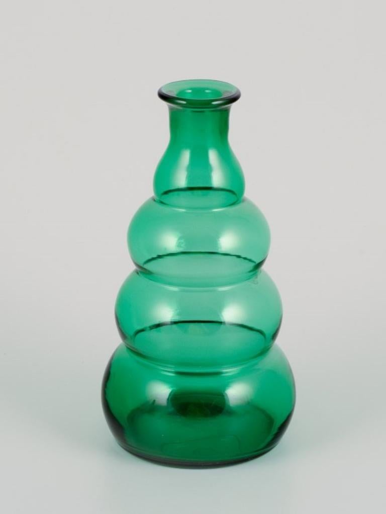 Mid-20th Century Pair of decanters in green art glass from a Swedish glassworks. For Sale