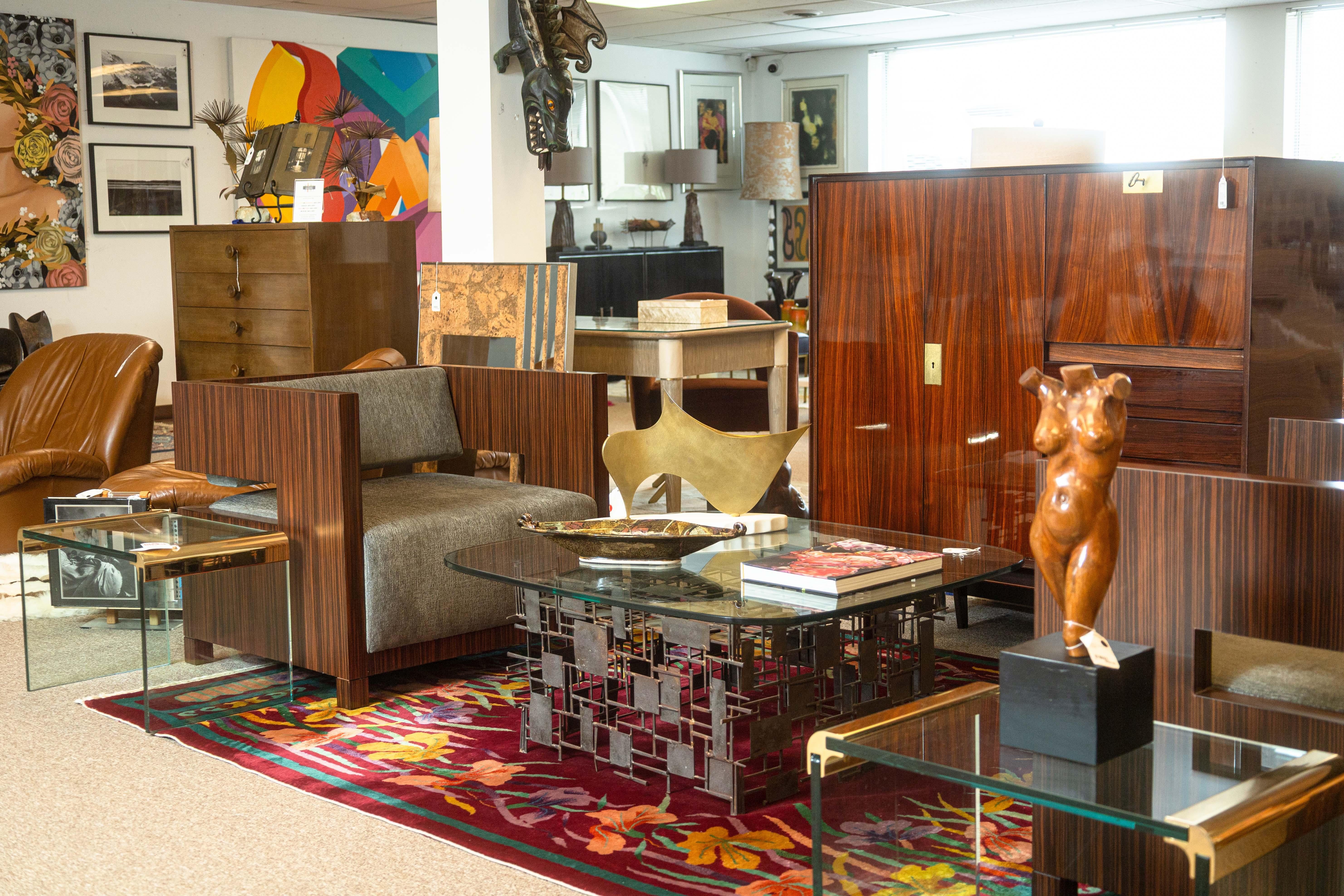 A pair of Decca Home Bolier Domicile cube chairs. This stunning set of contemporary cube chairs feature a chic modern design with a solid walnut wood construction. These chairs are extremely solid and heavy. The walnut veneer throughout the chairs